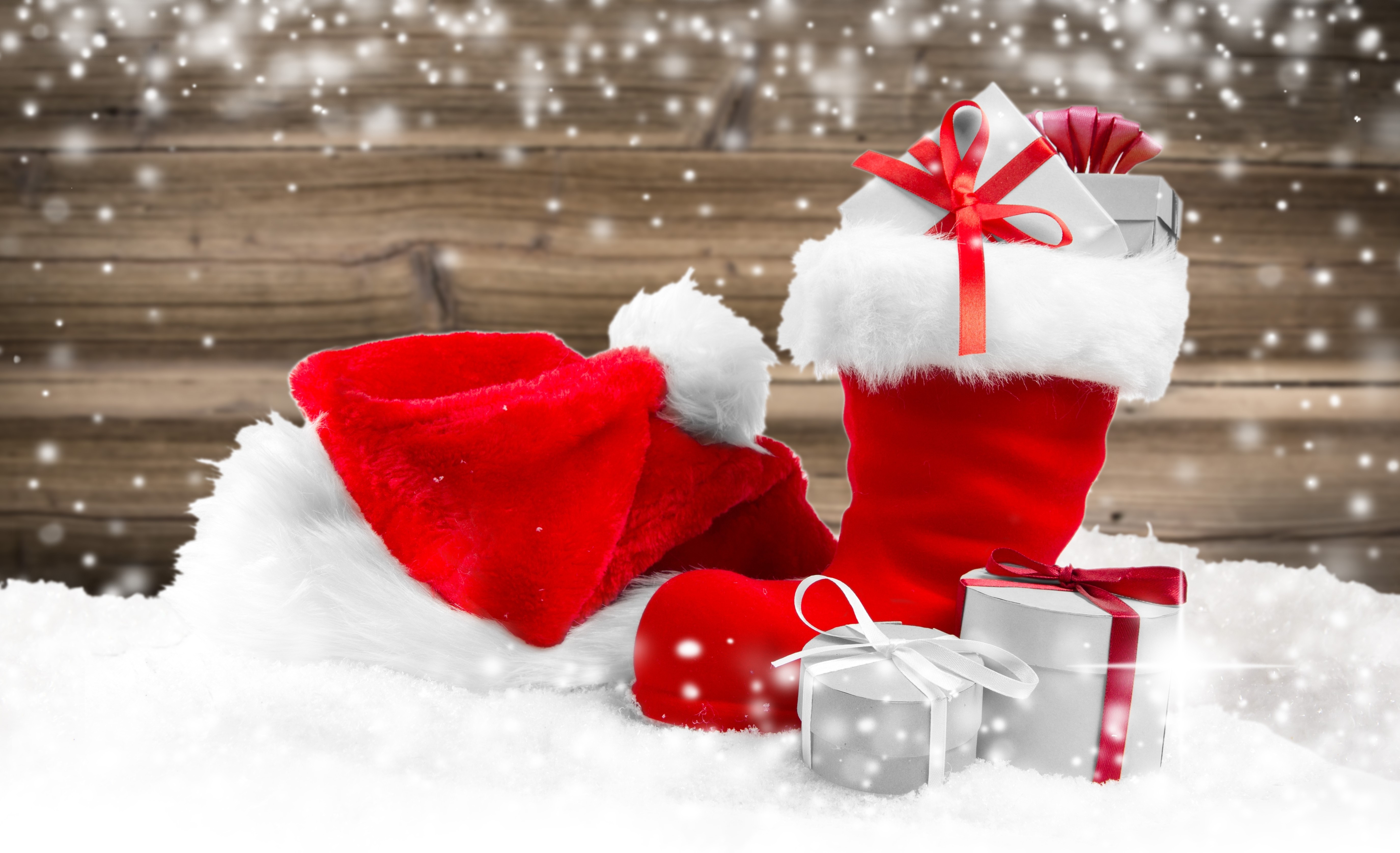 Christmas Gifts and Santa Hat in Snow HD Wallpaper