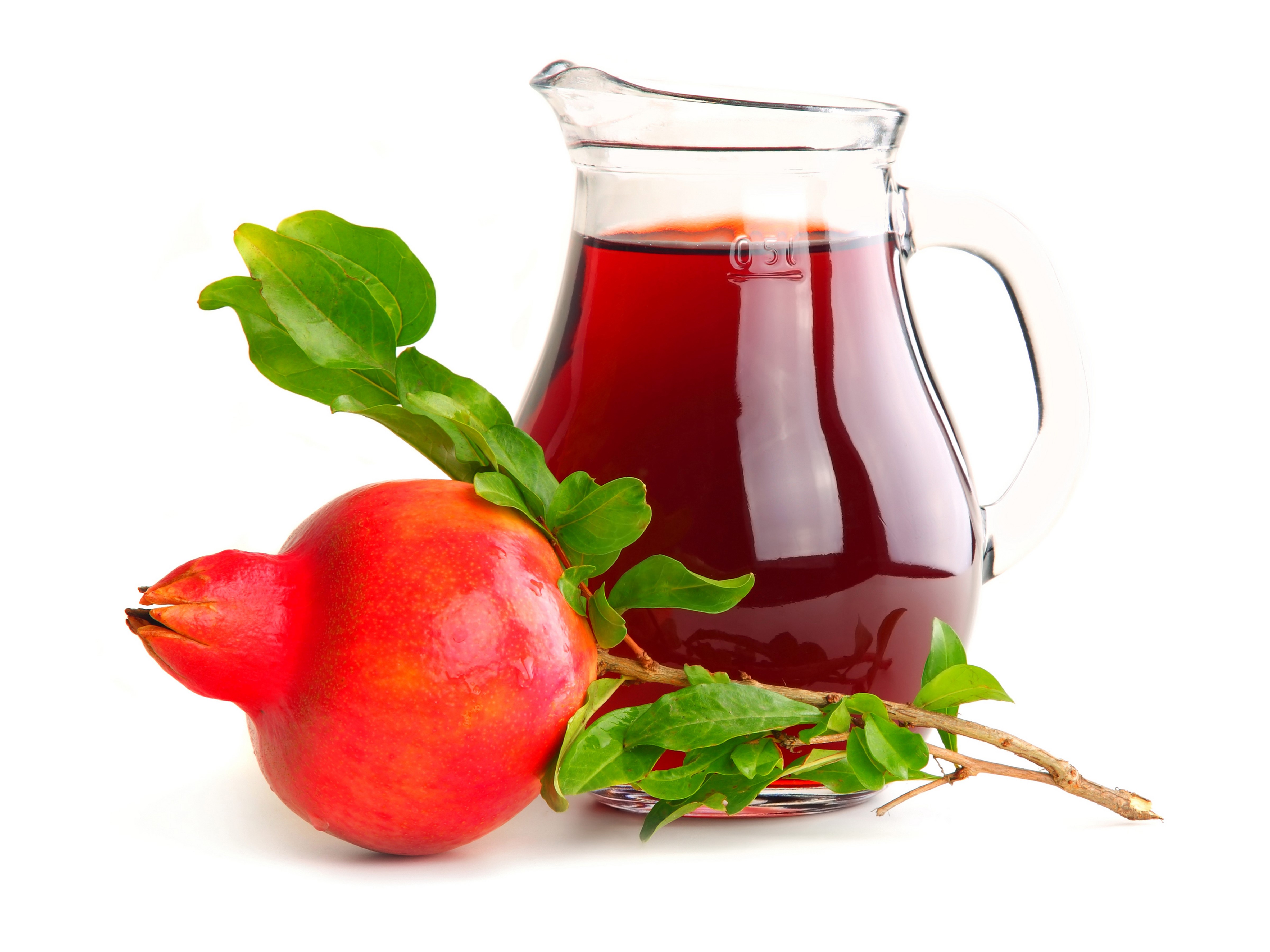 Pomegranate juice in a jug with a pomegranate HD Wallpaper