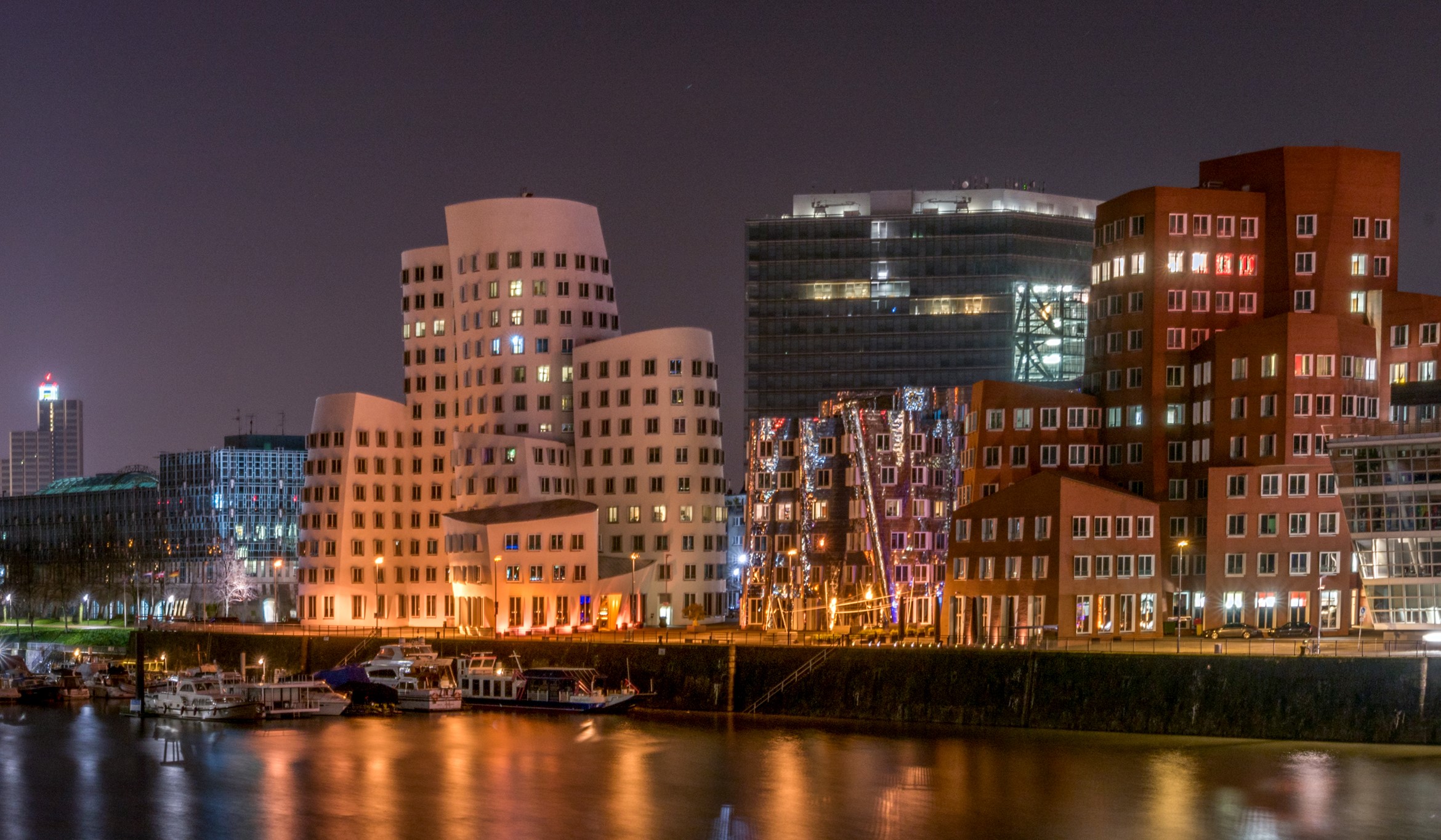 Night view of modern buildings and boats in Dusseldorf, Germany HD Wallpaper