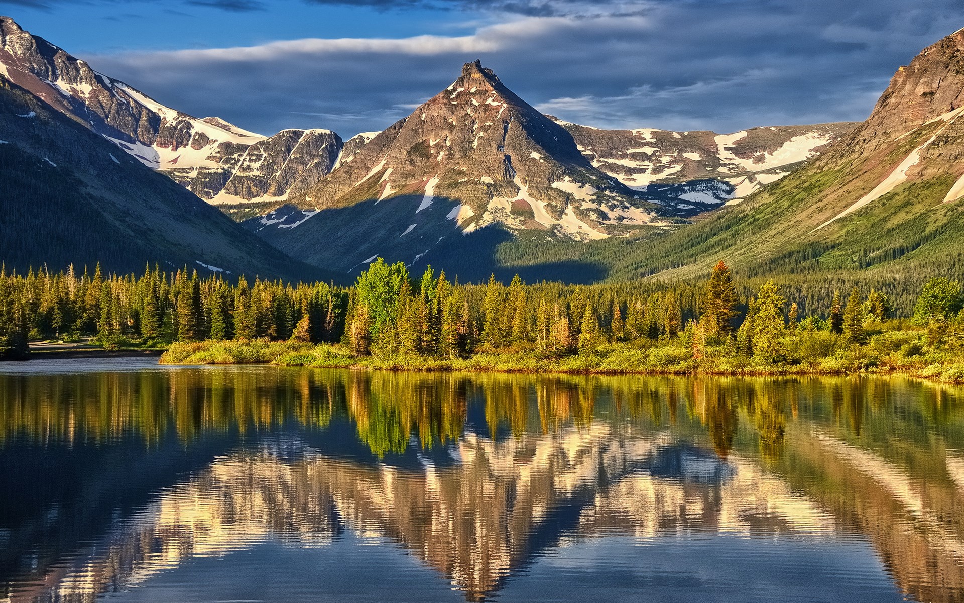 Mountain lake reflection with pine trees and snow-capped peaks HD Wallpaper
