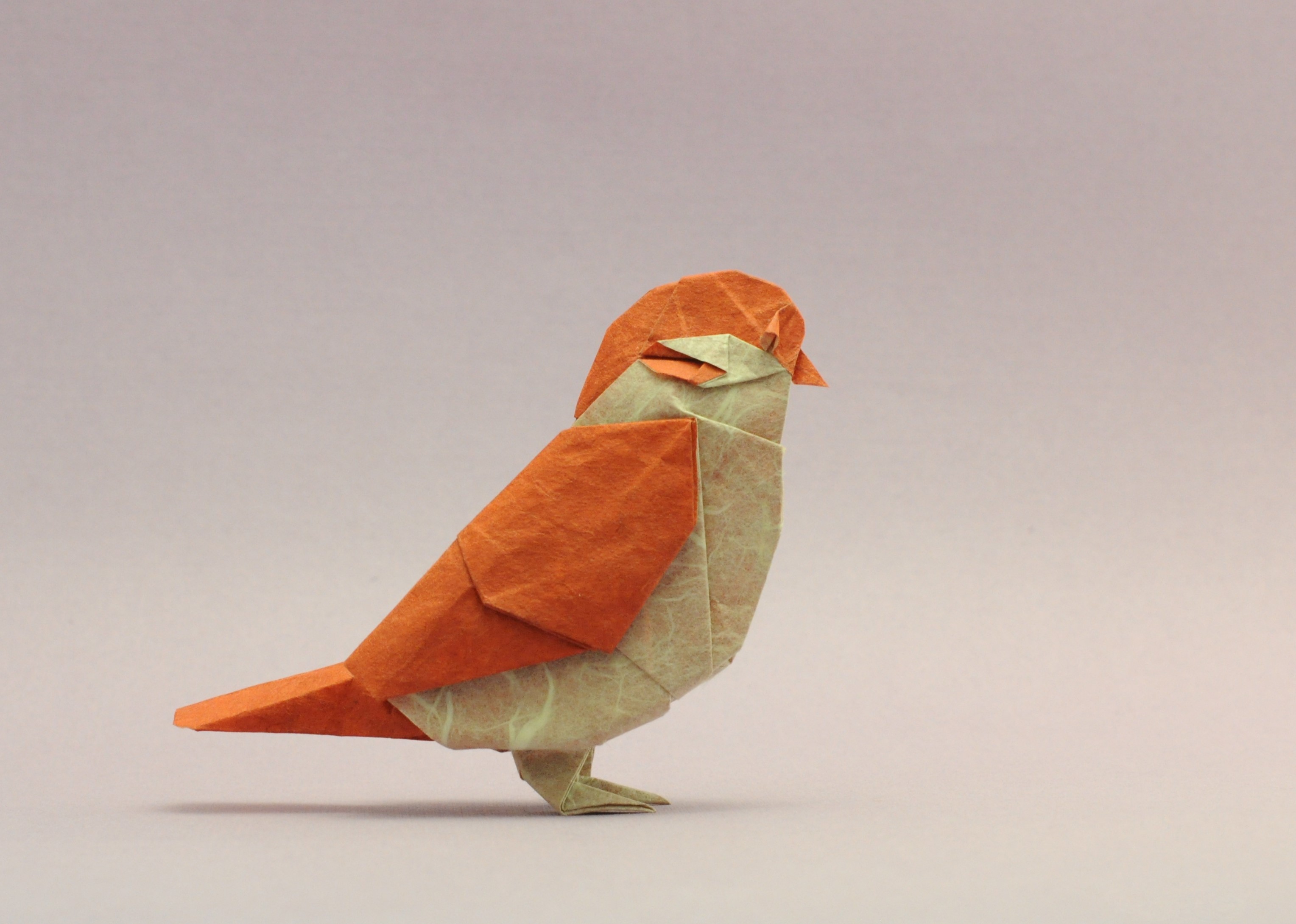 Origami bird made of orange and beige paper HD Wallpaper