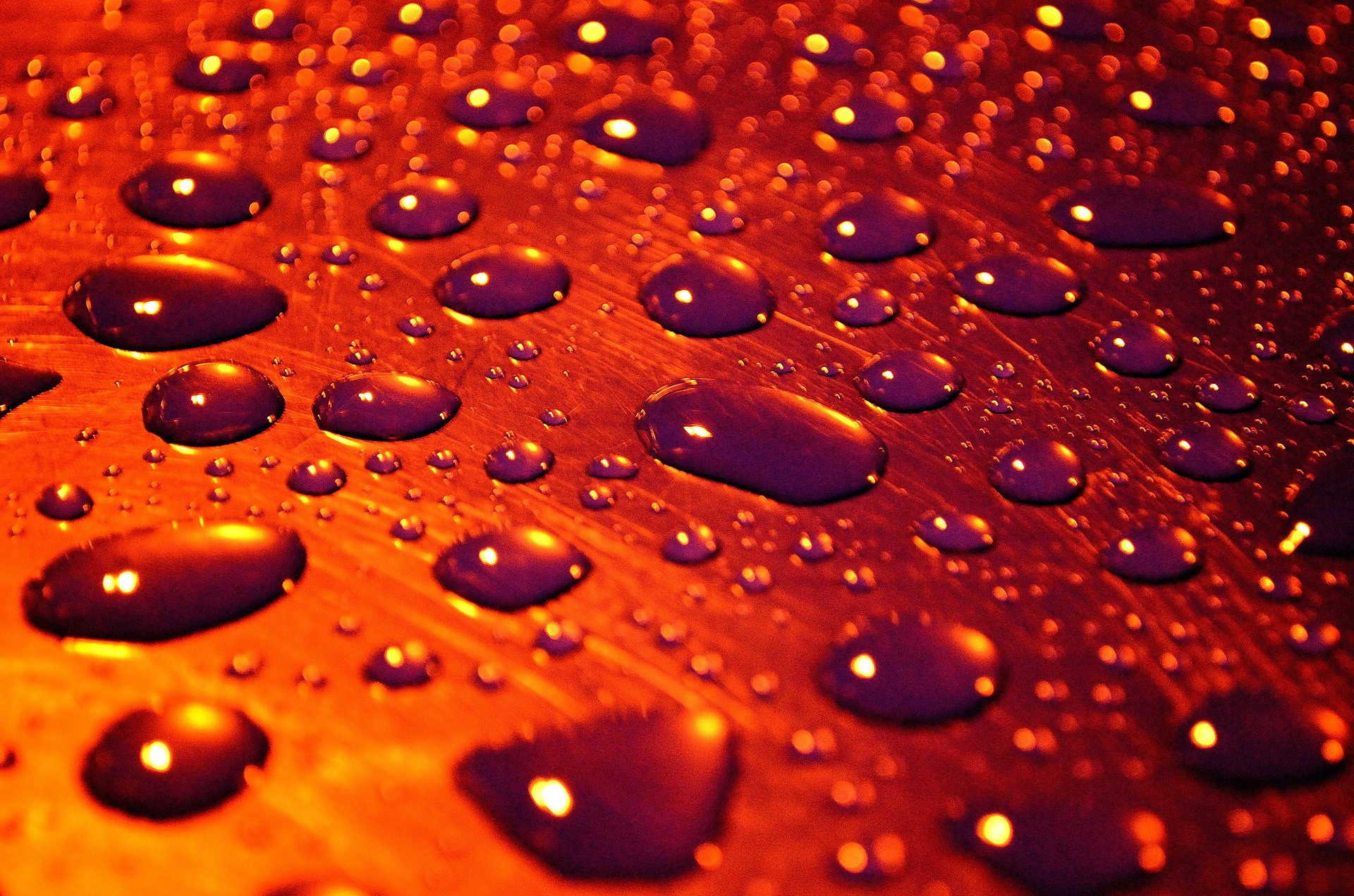 Water drops on a textured surface HD Wallpaper