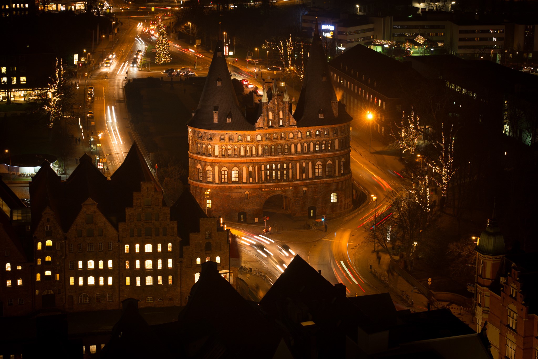 Holsten Gate at night in Lubeck, Germany HD Wallpaper