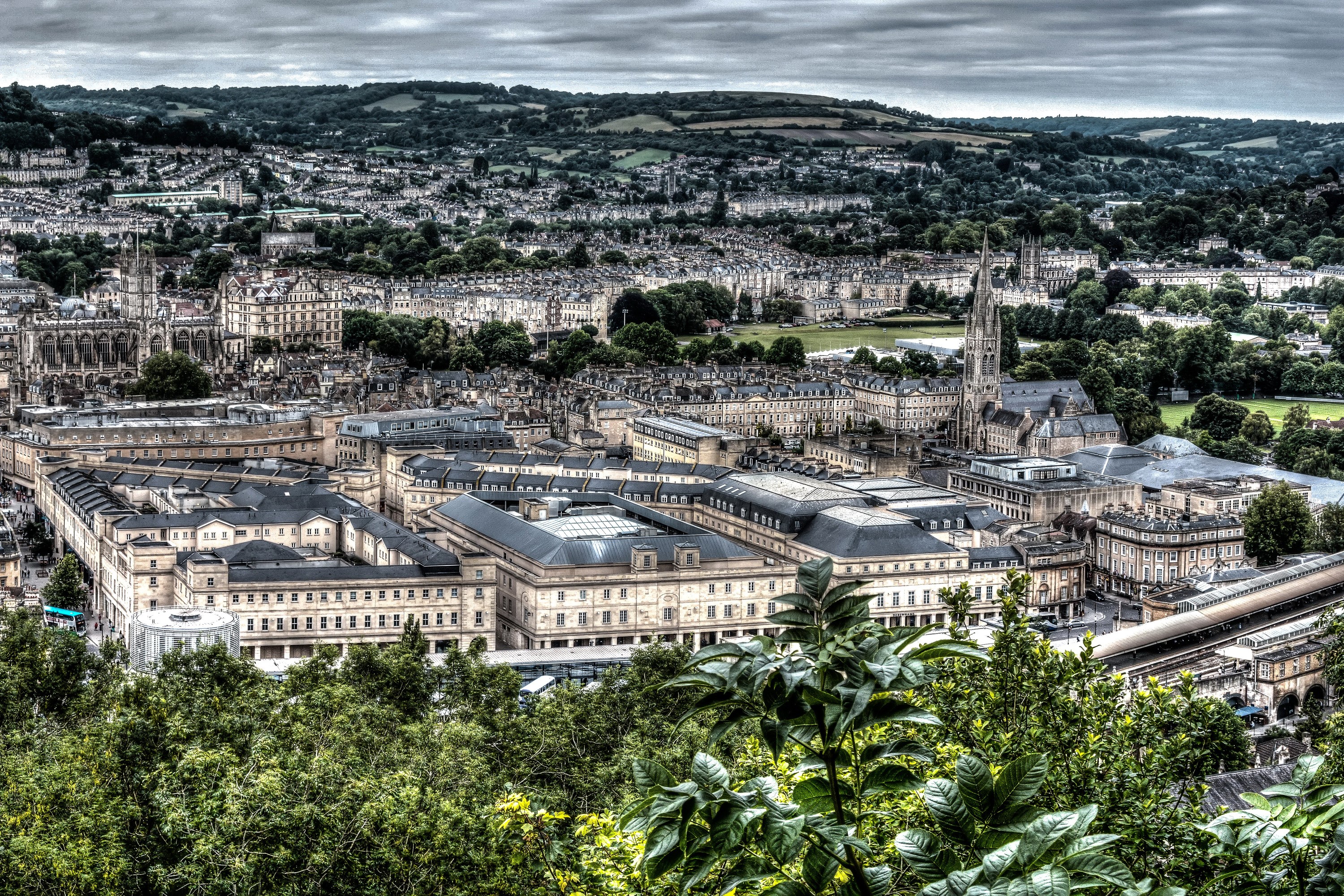 Aerial view of Bath, England with historic buildings and hills HD Wallpaper