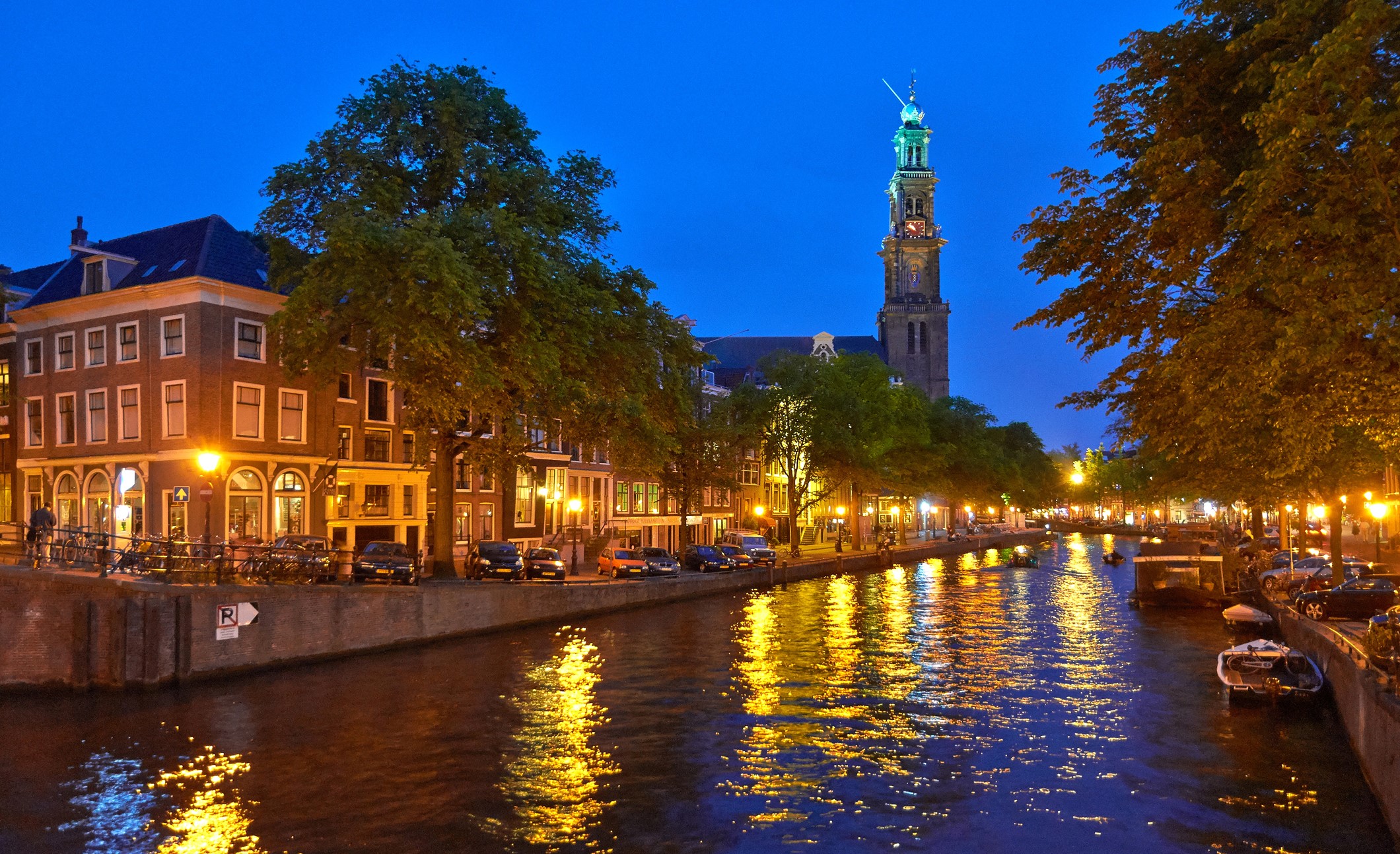 Amsterdam canal at night with Westerkerk tower HD Wallpaper