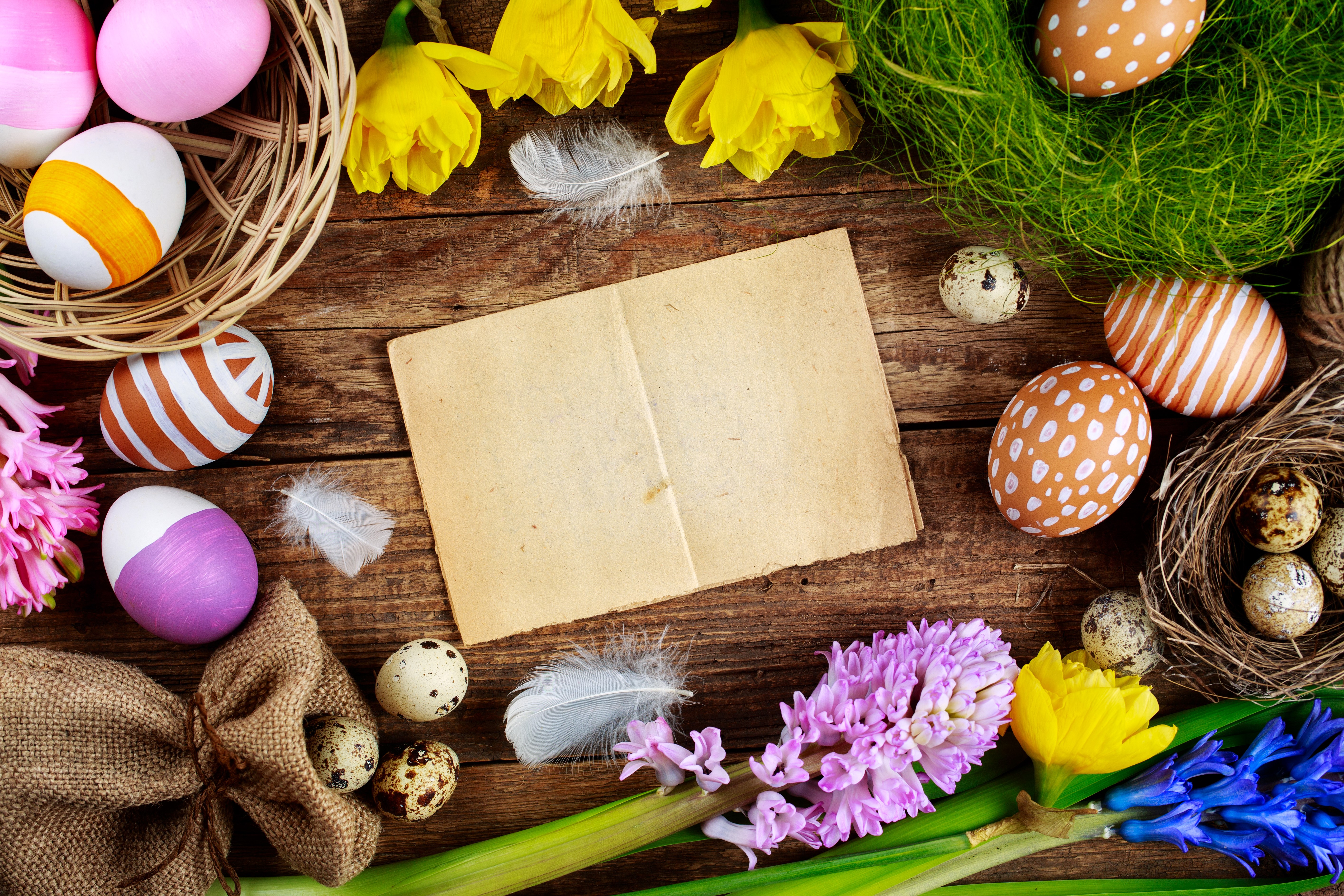 Easter eggs and flowers on a wooden table HD Wallpaper