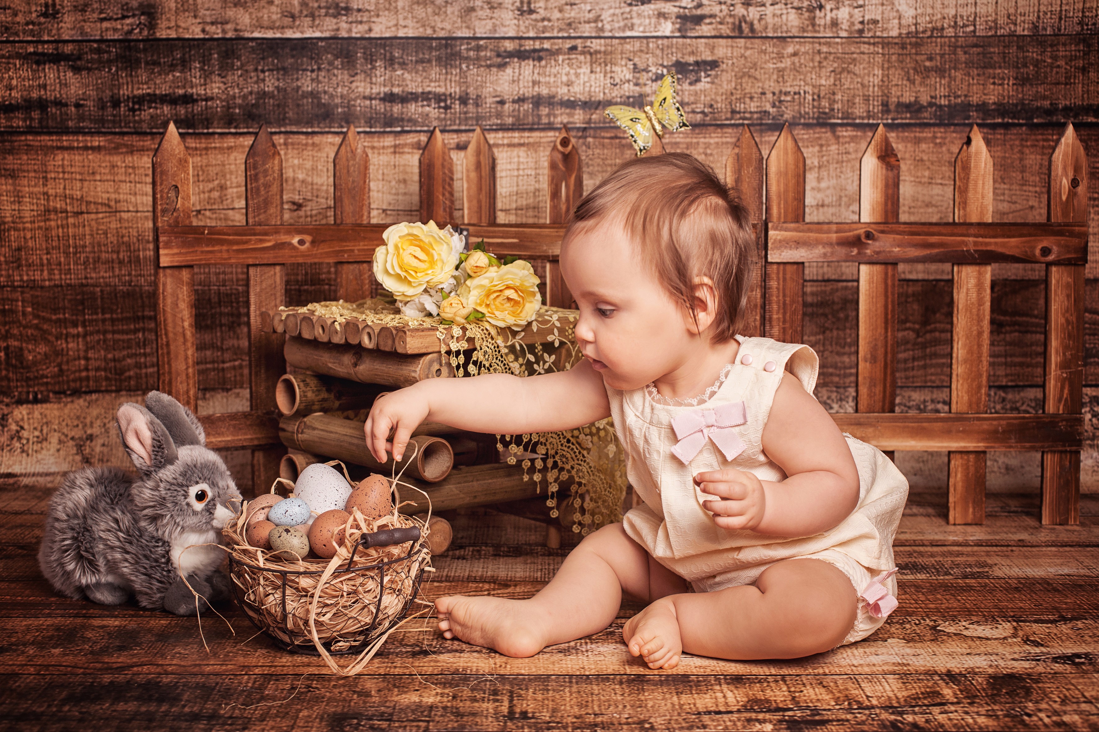 Baby reaching for Easter eggs with bunny and roses HD Wallpaper