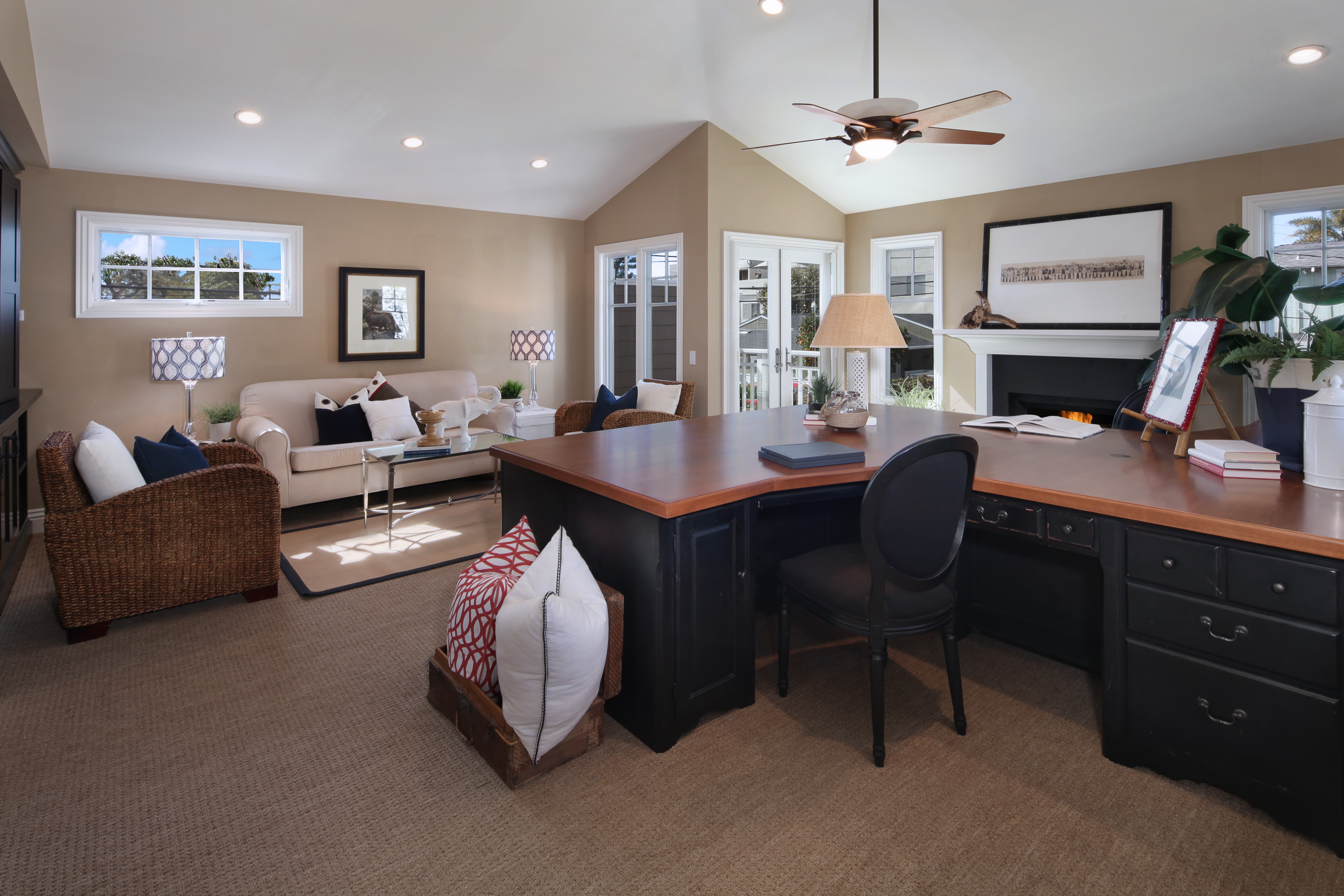 Home office with sofa, armchair, and desk HD Wallpaper