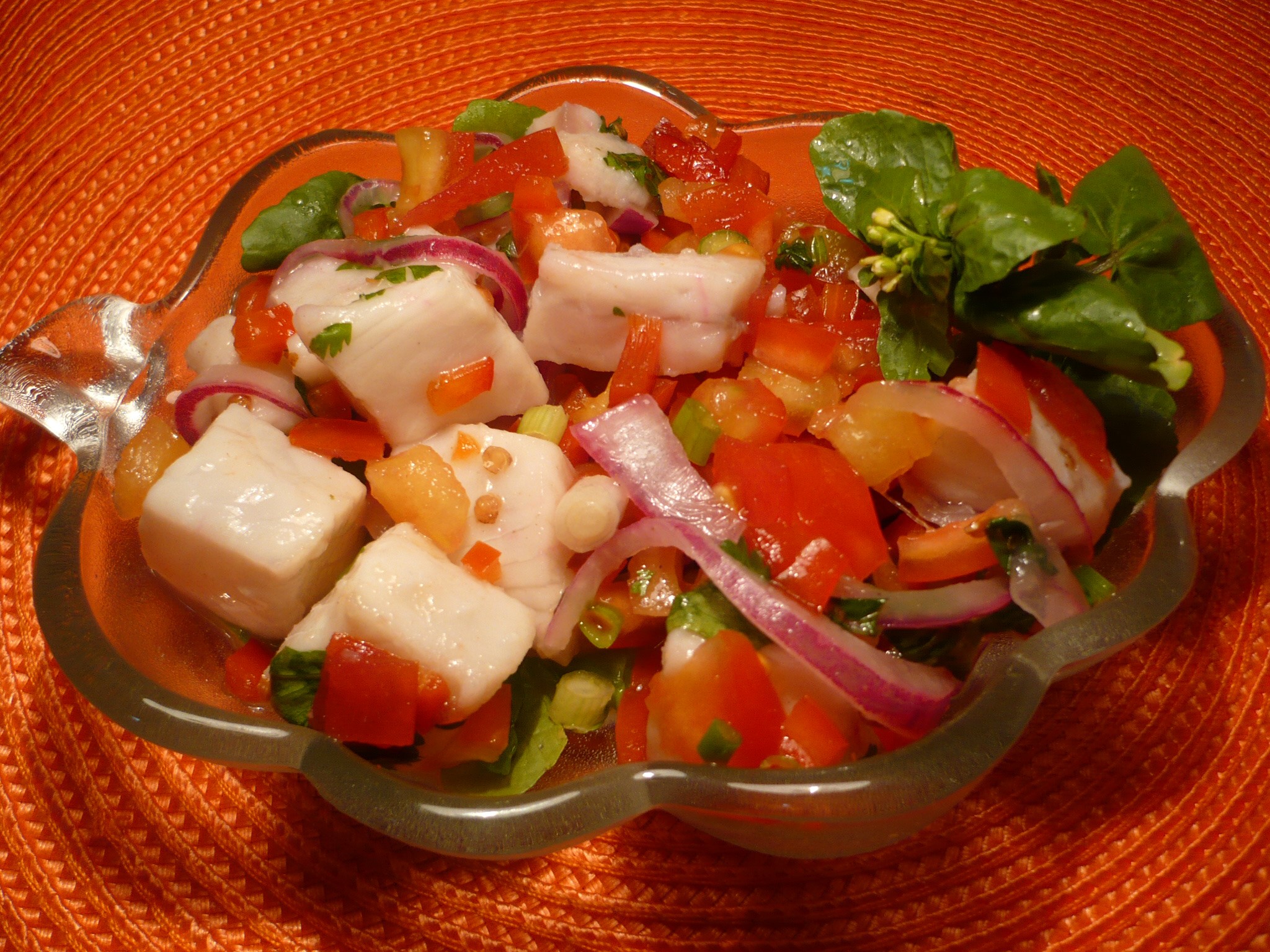 Ceviche with tomatoes, onions, and greens in a bowl HD Wallpaper