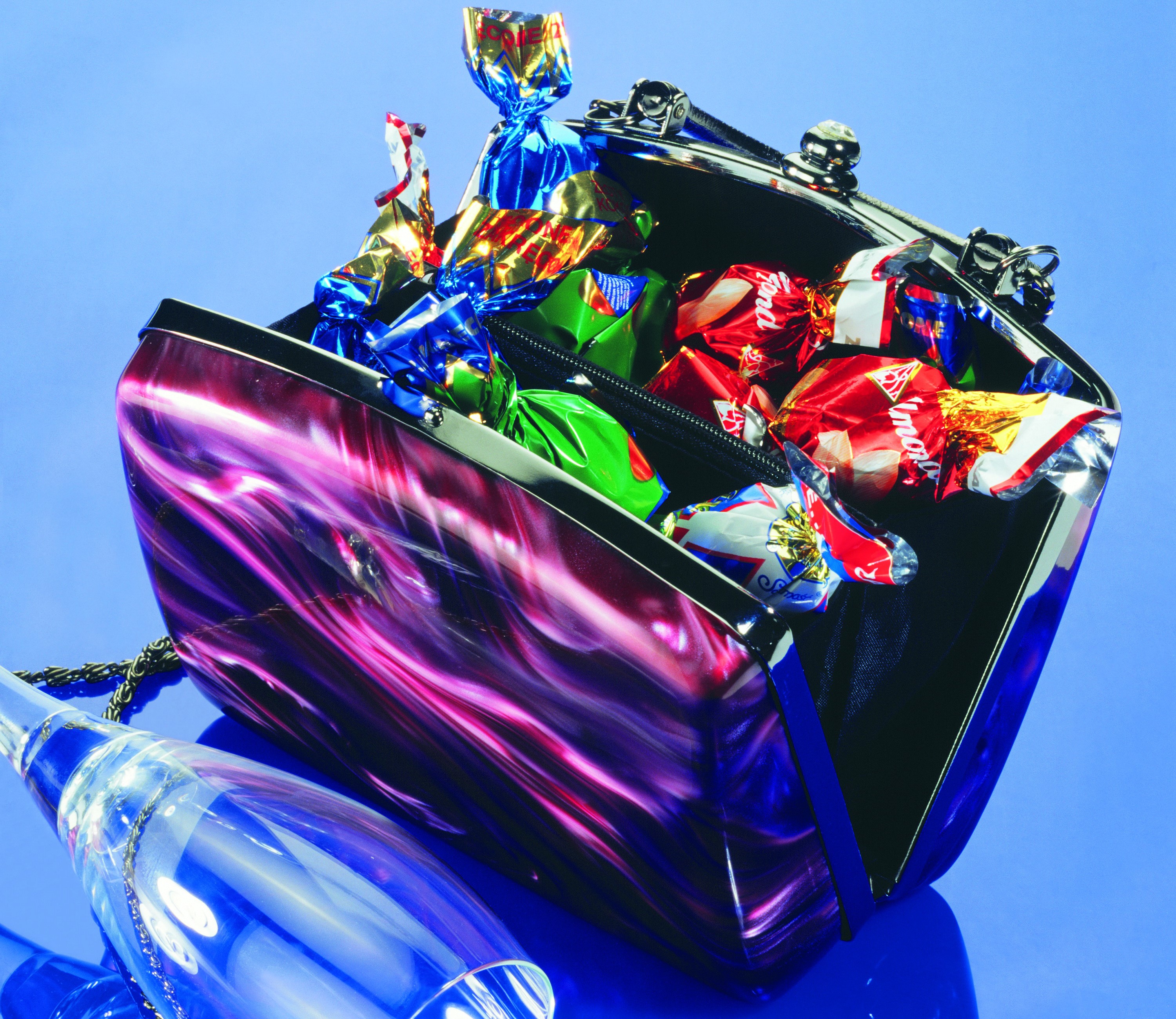 Handbag filled with assorted candies HD Wallpaper