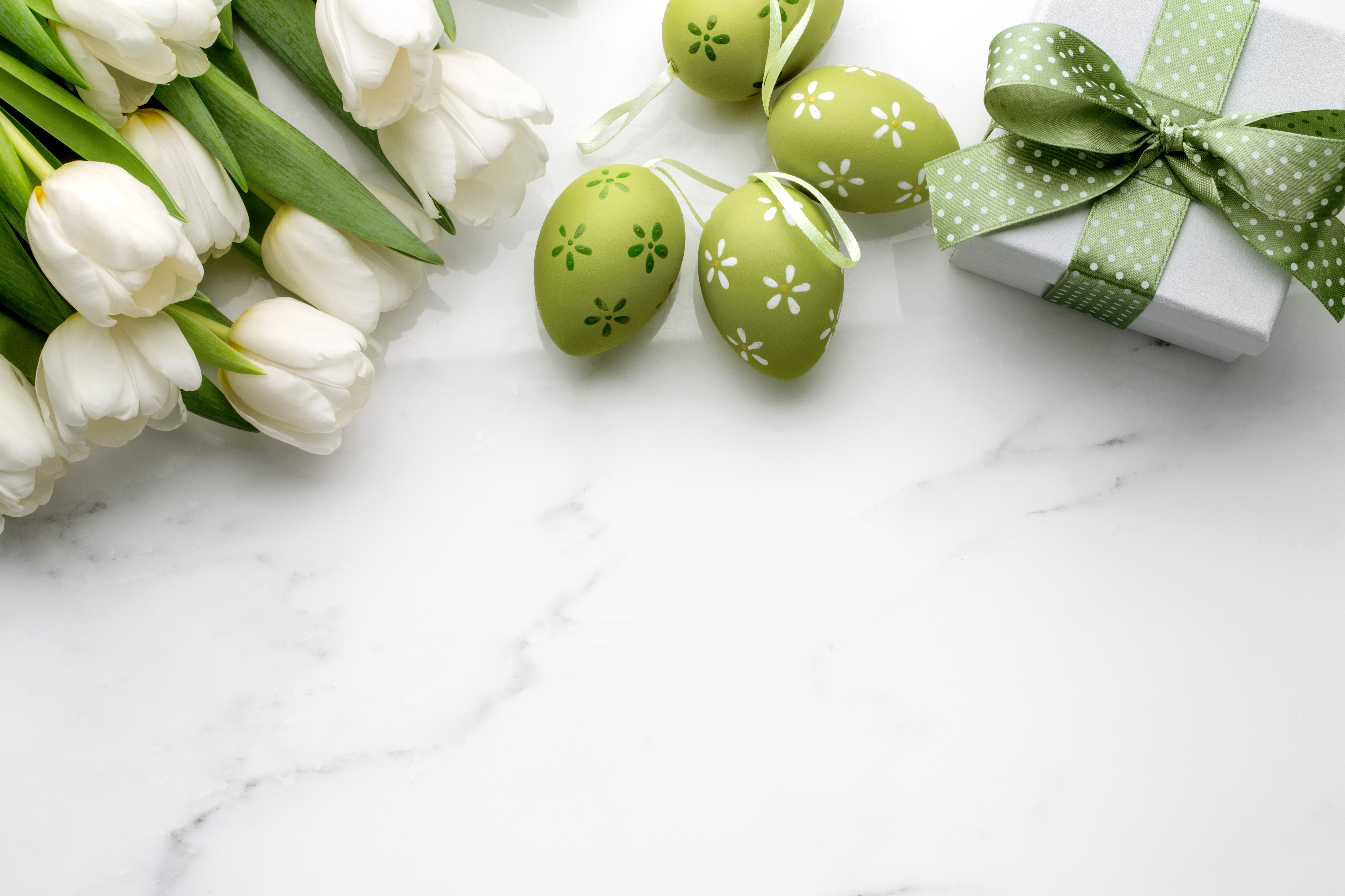 Easter tulips, eggs, and gift on marble HD Wallpaper