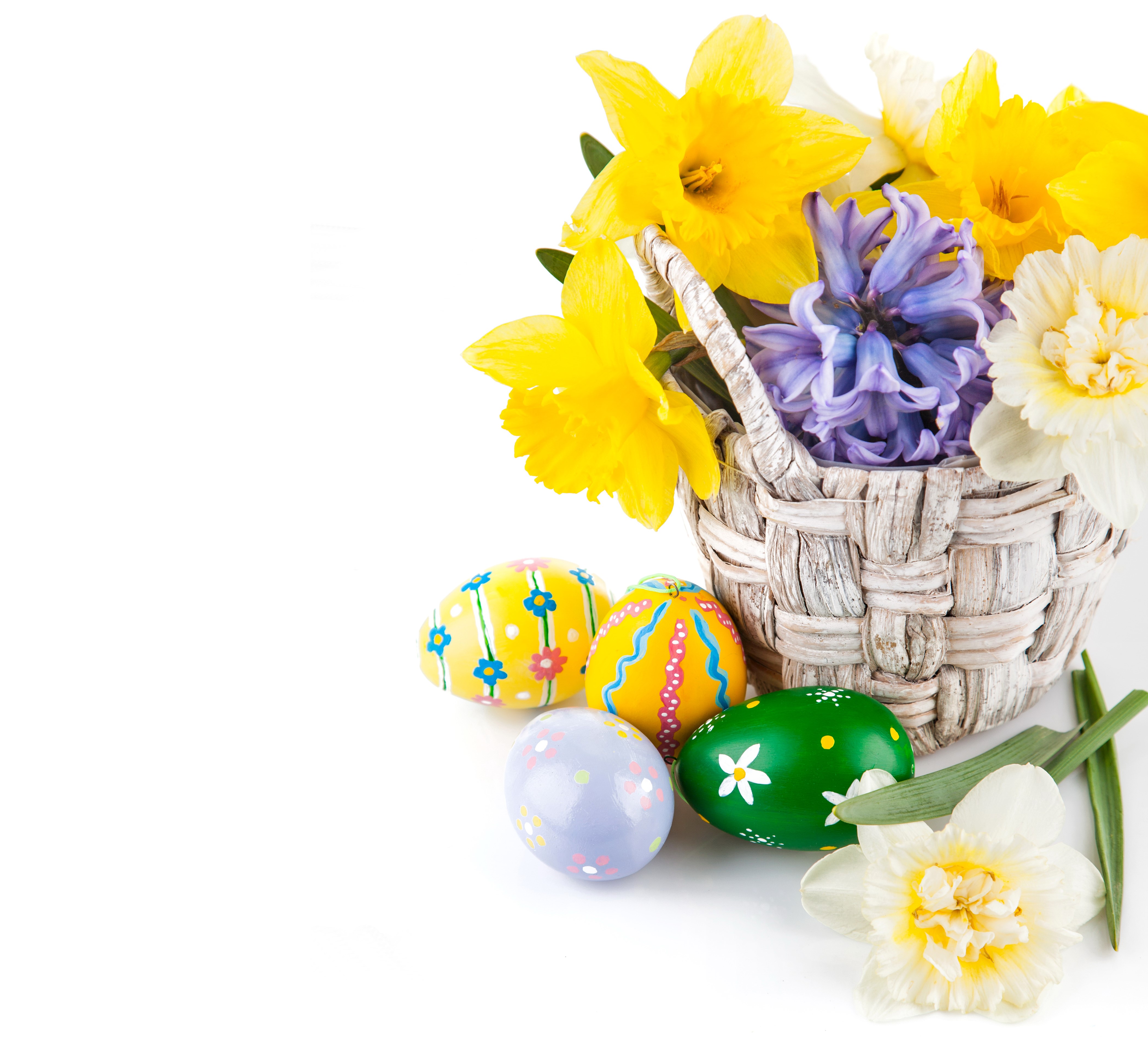 Easter basket with daffodils, hyacinths, and painted eggs HD Wallpaper