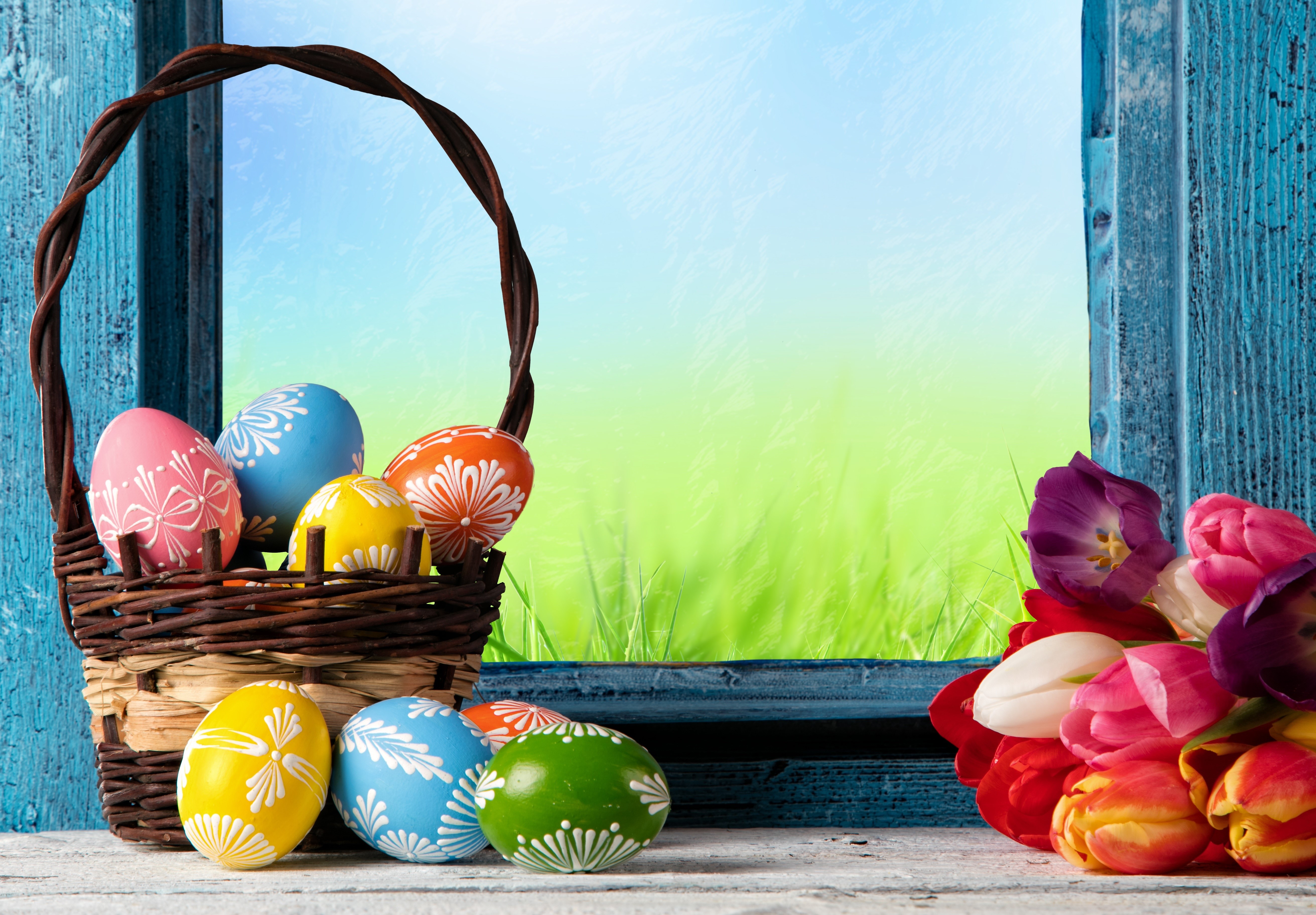 Easter eggs in a basket by a window HD Wallpaper