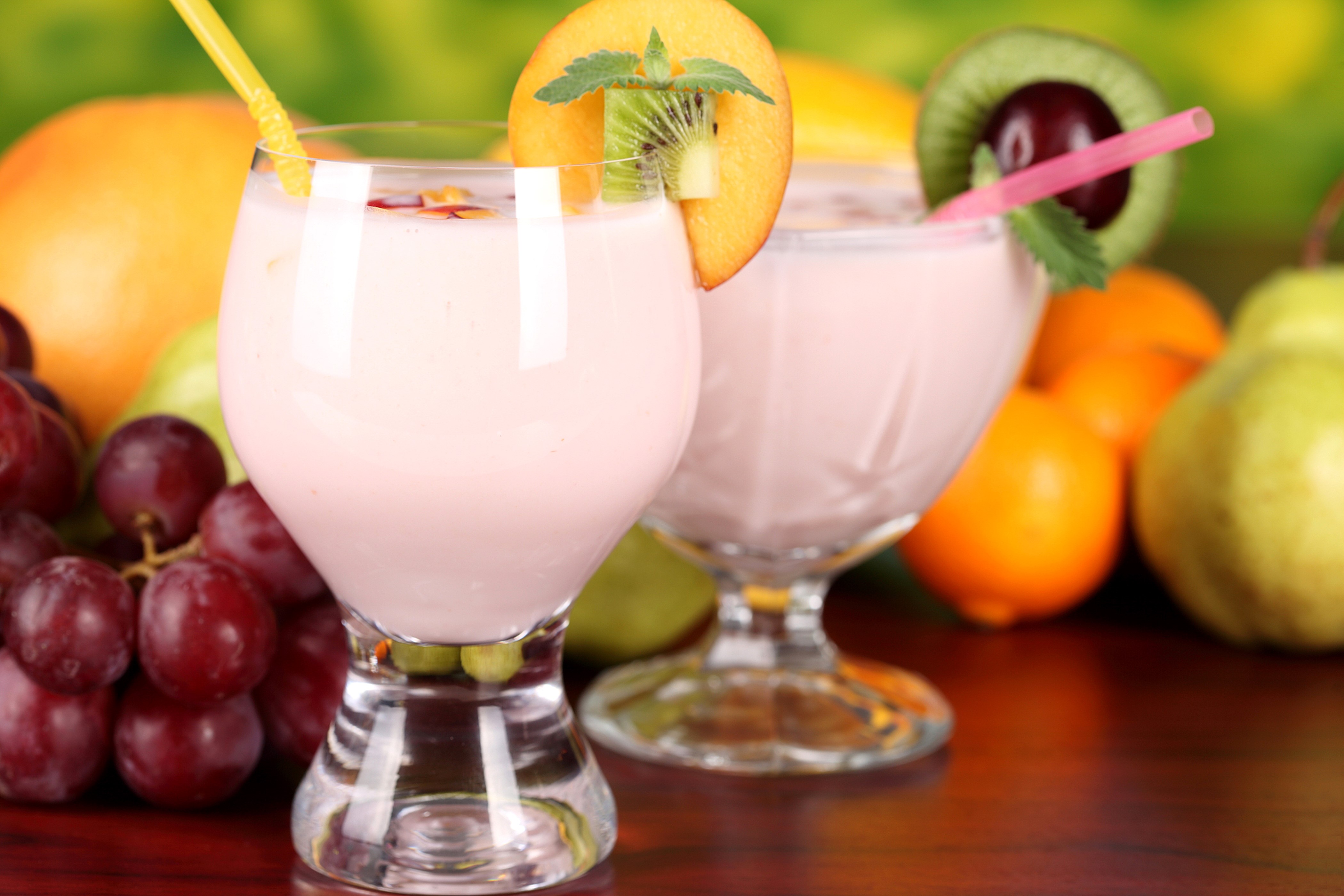 Fruit drinks with grapes, oranges, pears, and kiwi HD Wallpaper