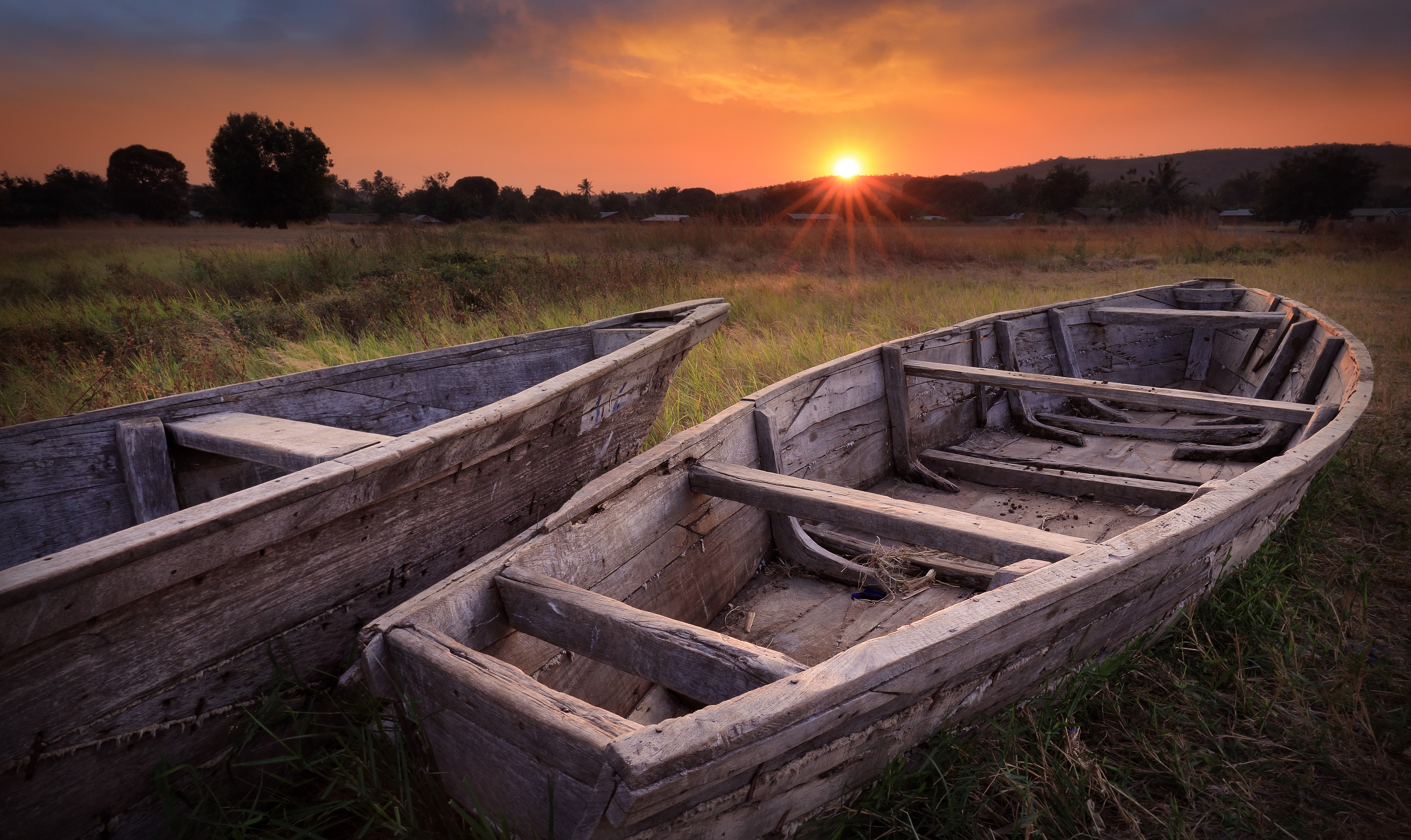 Two wooden boats at sunset HD Wallpaper
