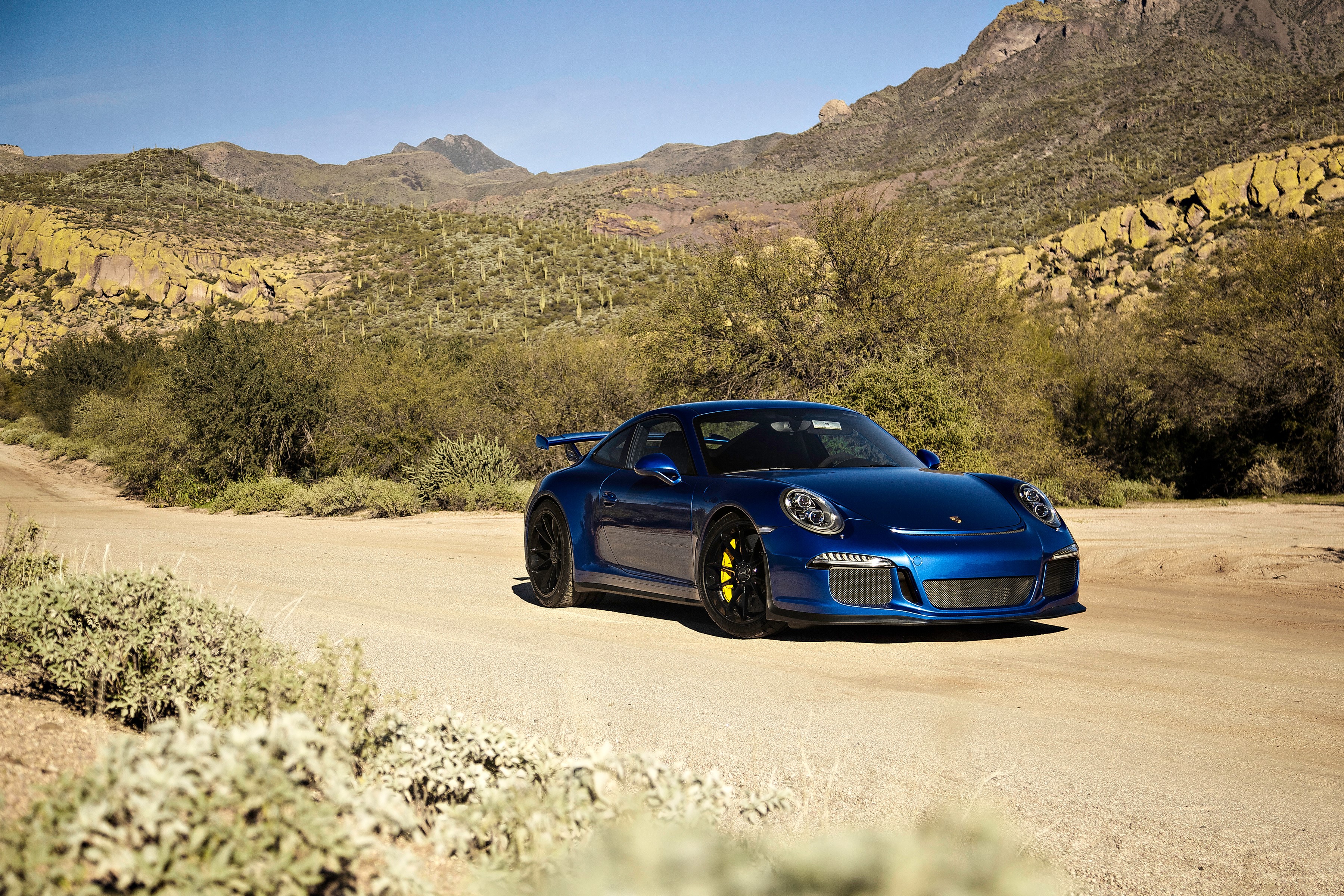 Blue 2014 Porsche 911 GT3 in desert landscape HD Wallpaper