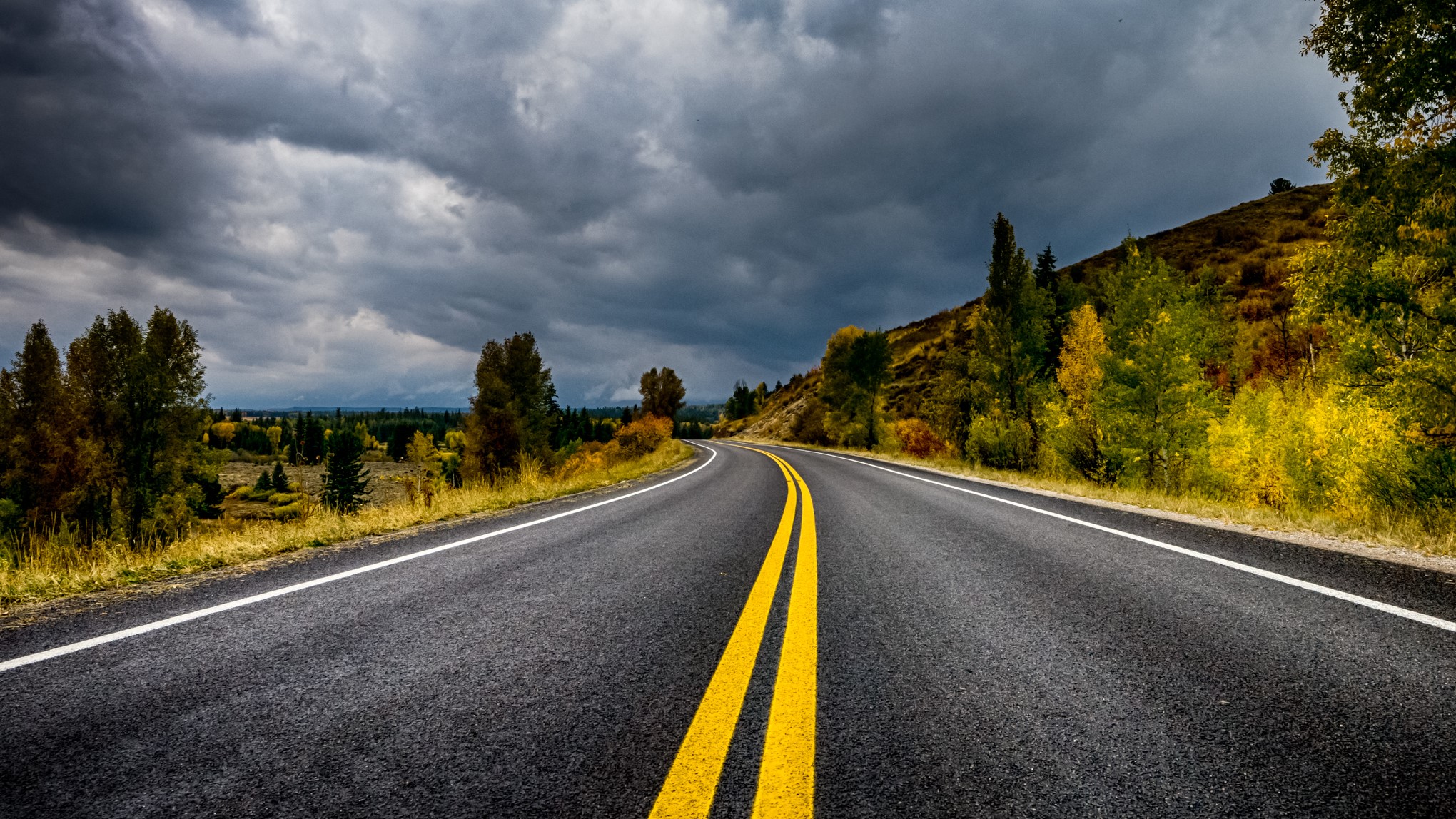 Winding Road Through Autumn Landscape HD Wallpaper