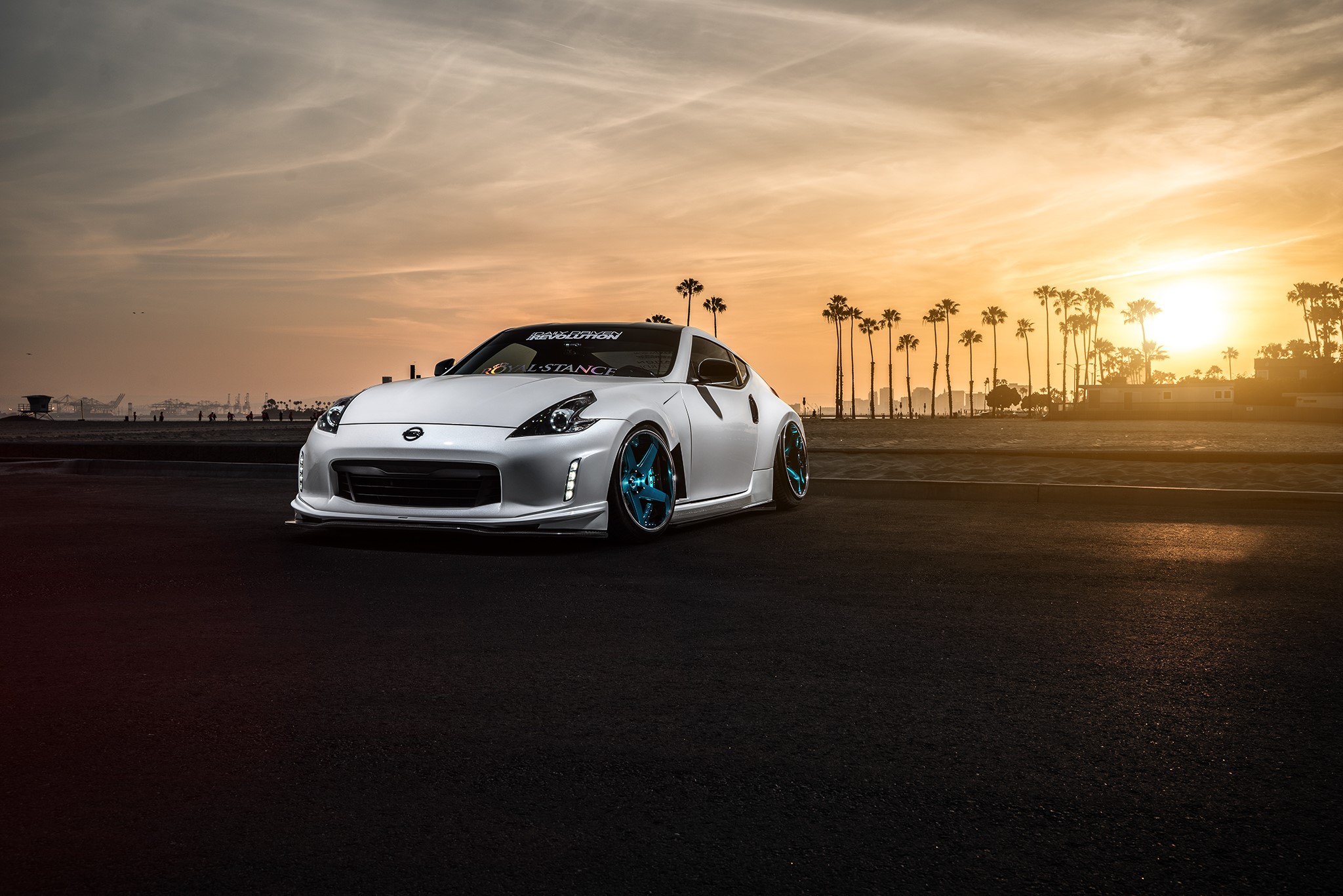 White Nissan 370Z Avant with blue rims at sunset HD Wallpaper