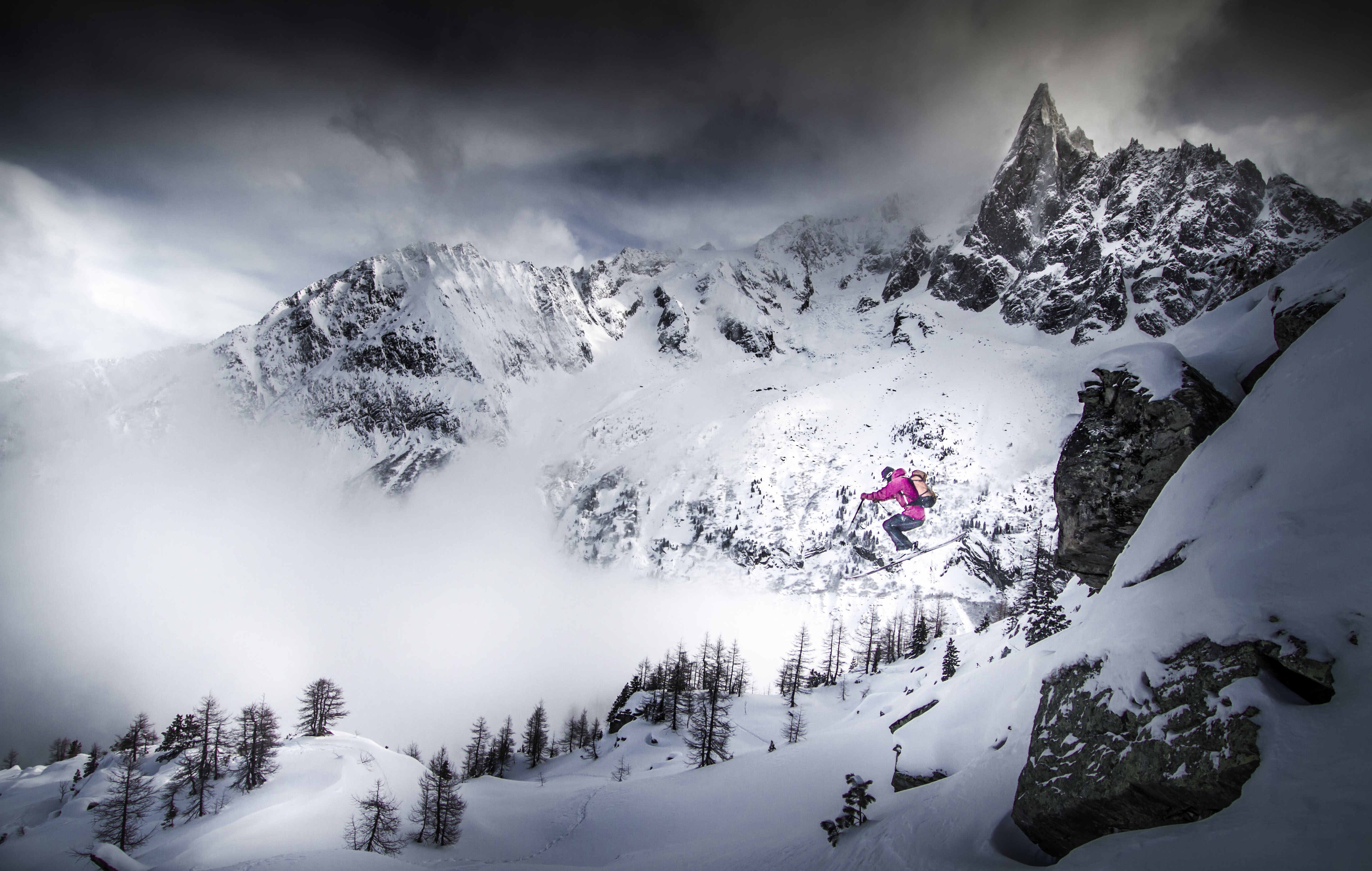 Snowboarder jumping in snowy mountains HD Wallpaper