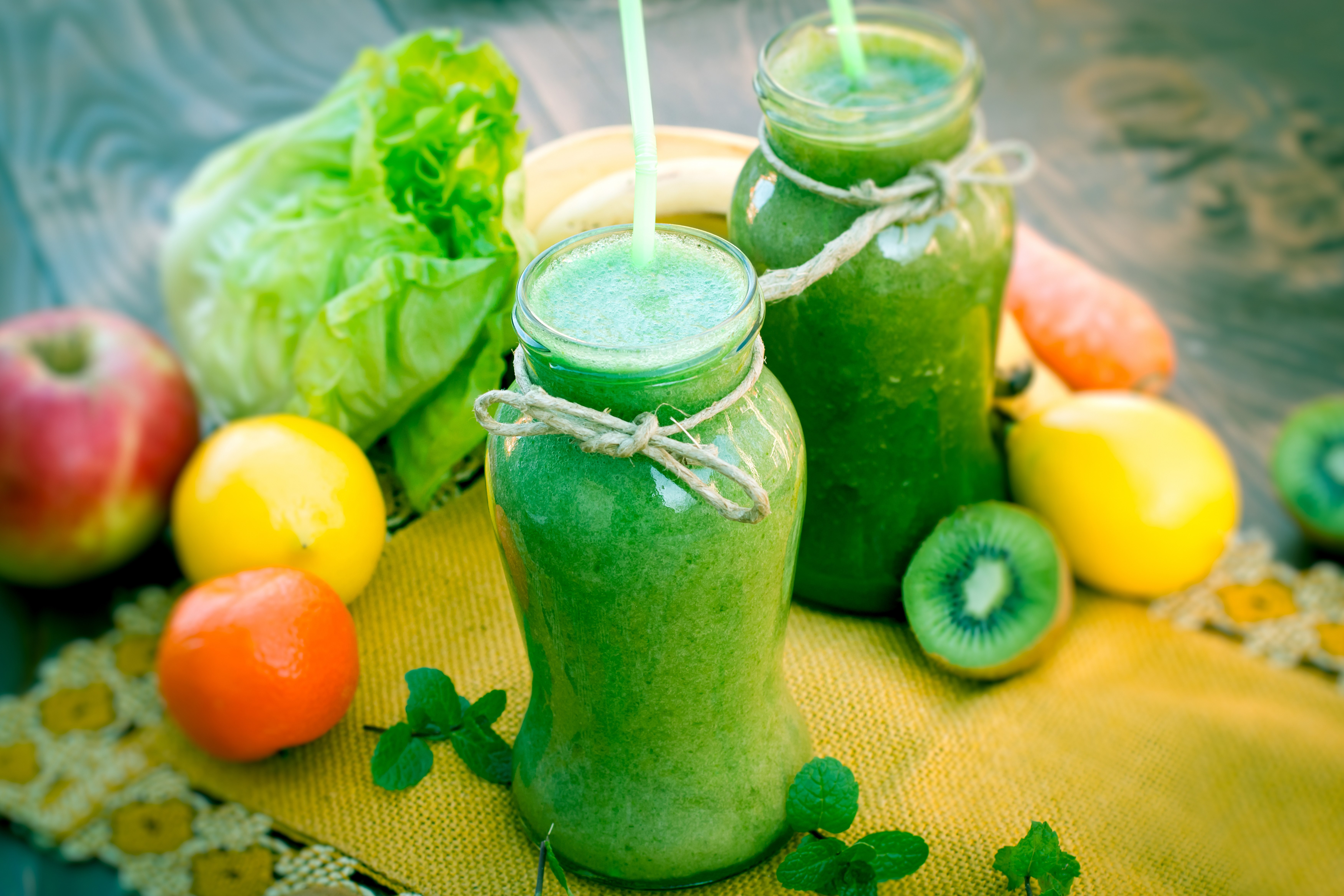 Two jars of green smoothie with fruits and vegetables HD Wallpaper