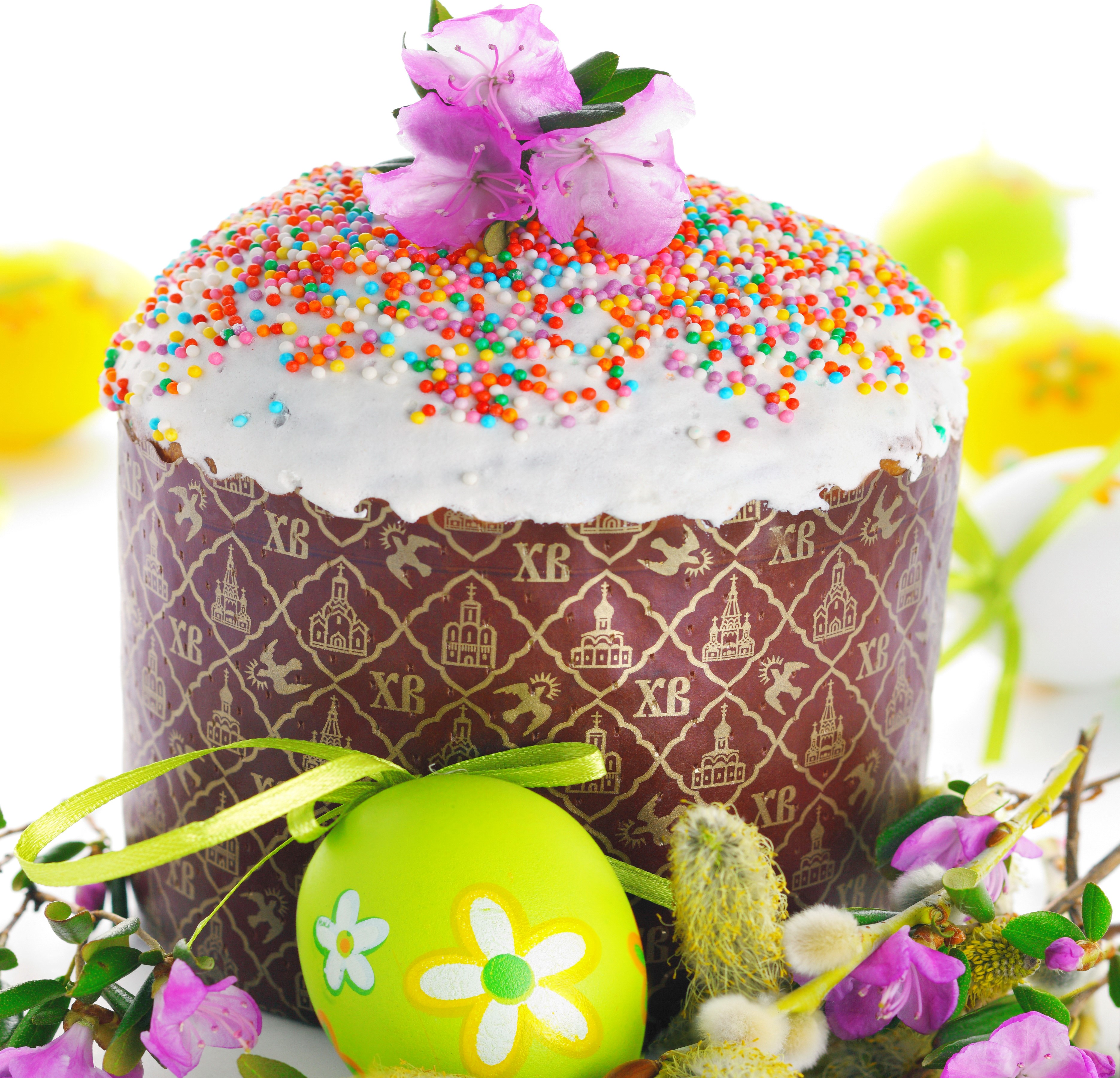 Easter Kulich cake with colorful sprinkles and decorated egg HD Wallpaper