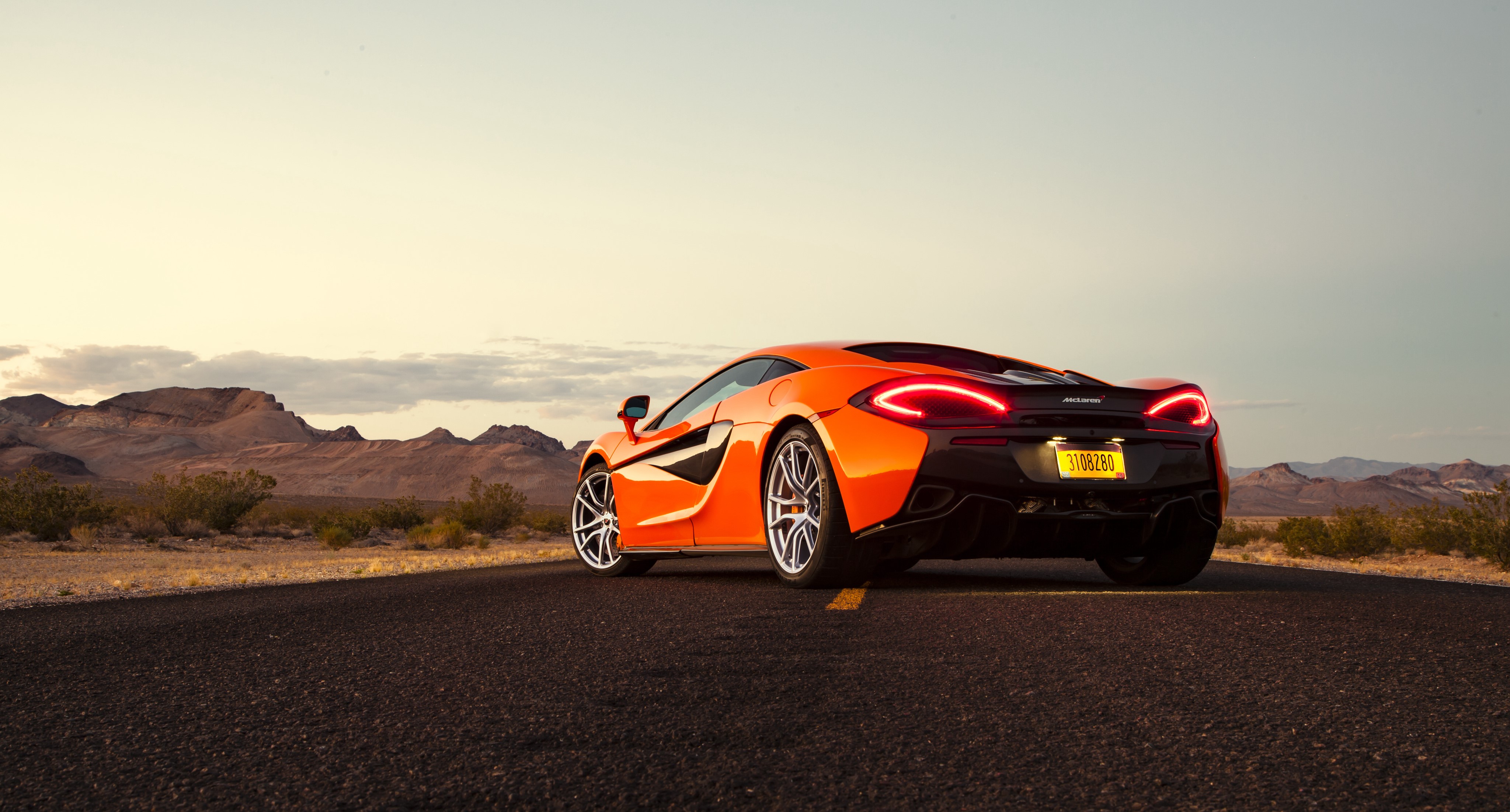 Orange McLaren 570S Coupe on Desert Road HD Wallpaper