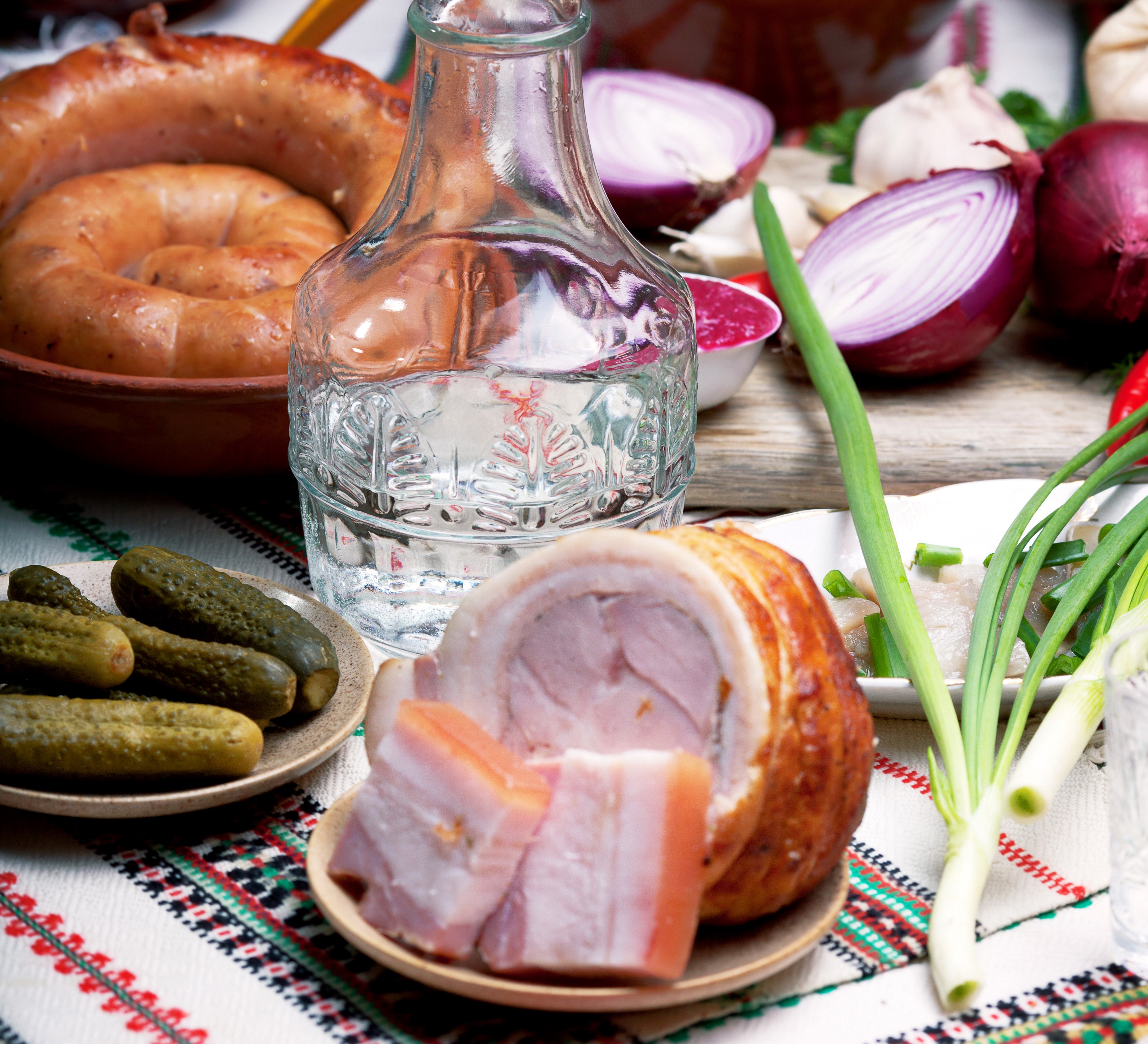 Still life with sausage, cucumbers, vodka, onion, and salo HD Wallpaper