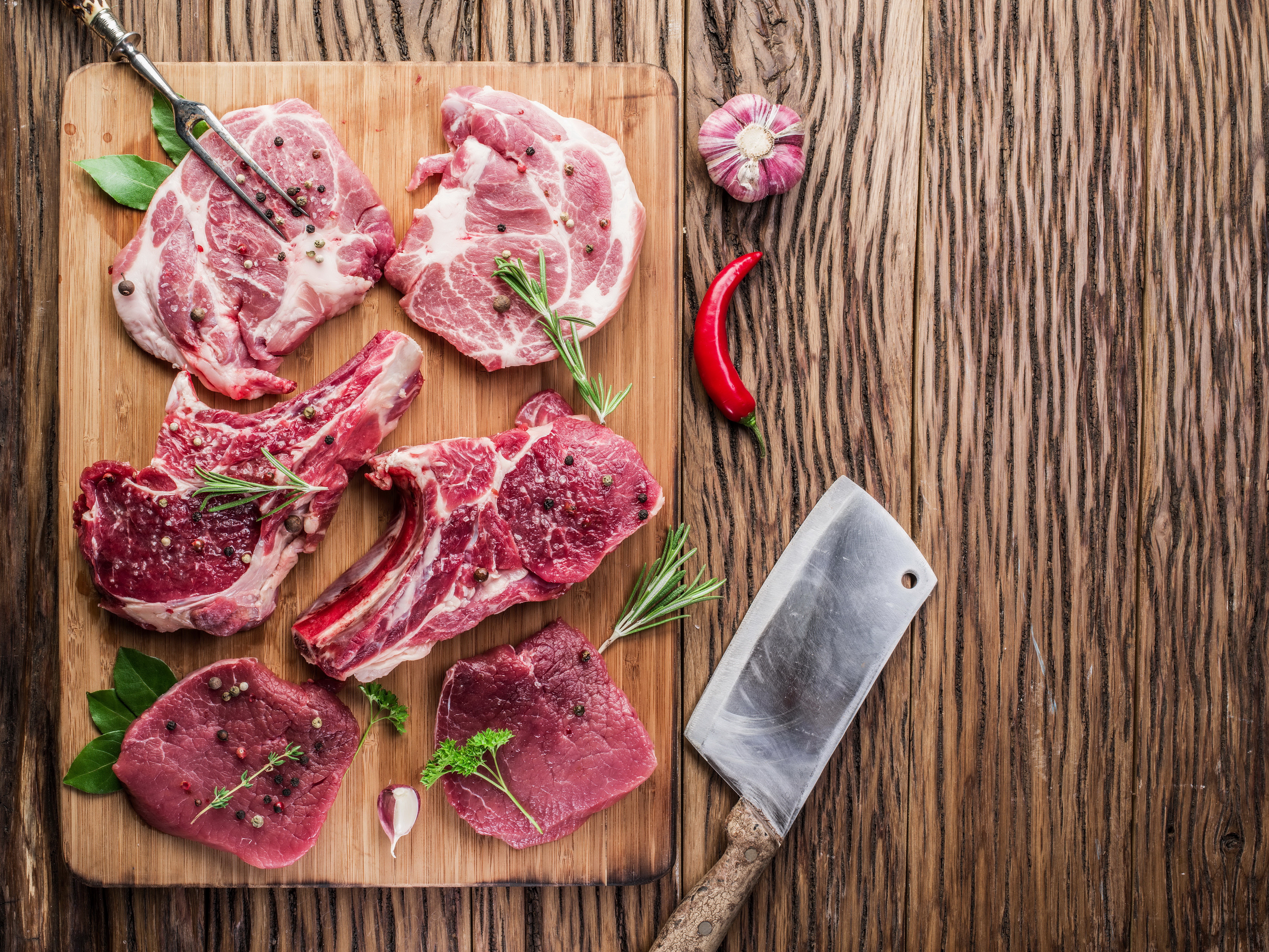 Raw Meat Cuts with Spices and Garlic on Cutting Board HD Wallpaper