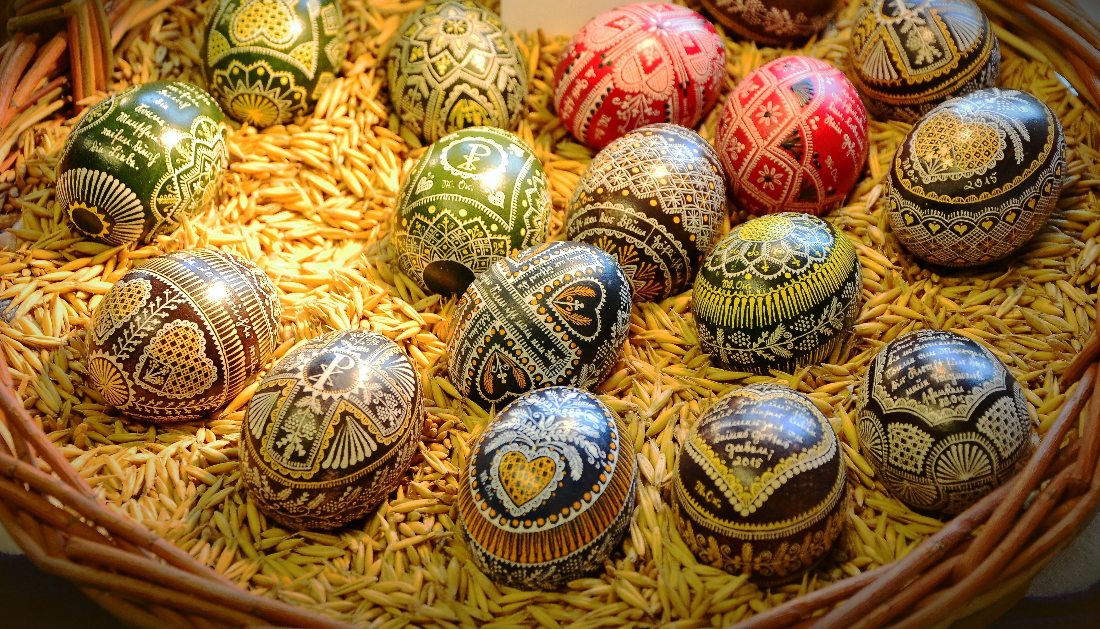 Decorated Easter Eggs in a Basket of Grain HD Wallpaper