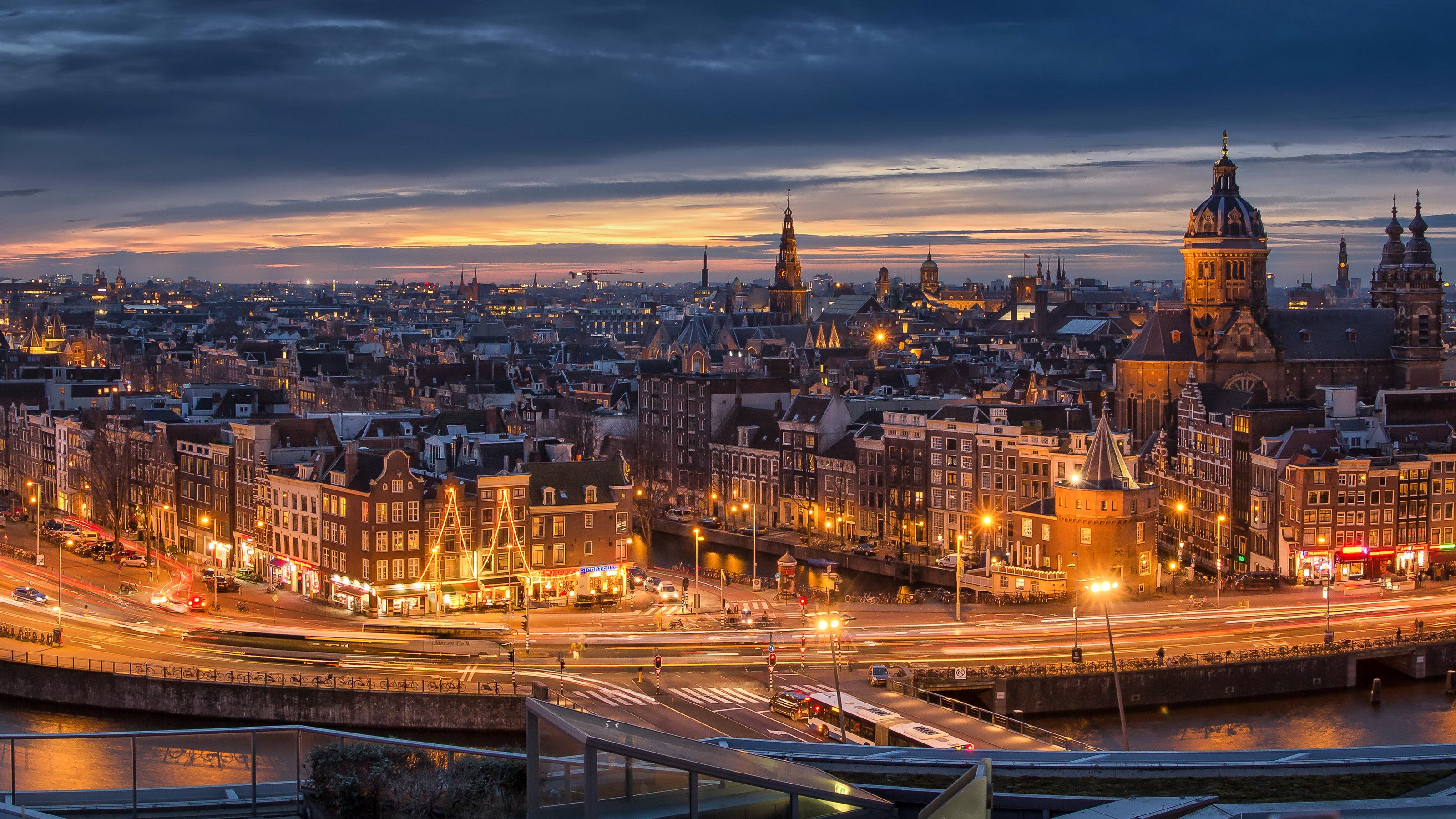 Amsterdam cityscape at dusk with canals and lights HD Wallpaper