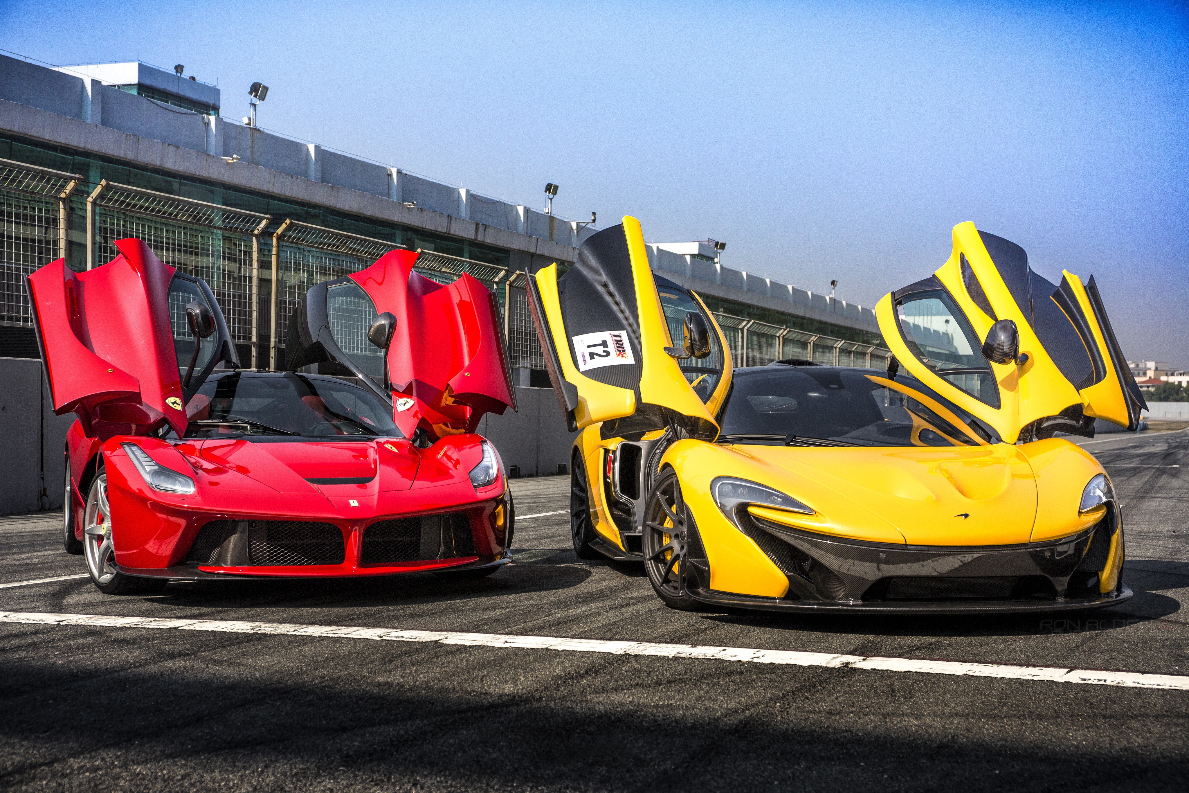 Ferrari and McLaren Supercars with Opened Doors HD Wallpaper