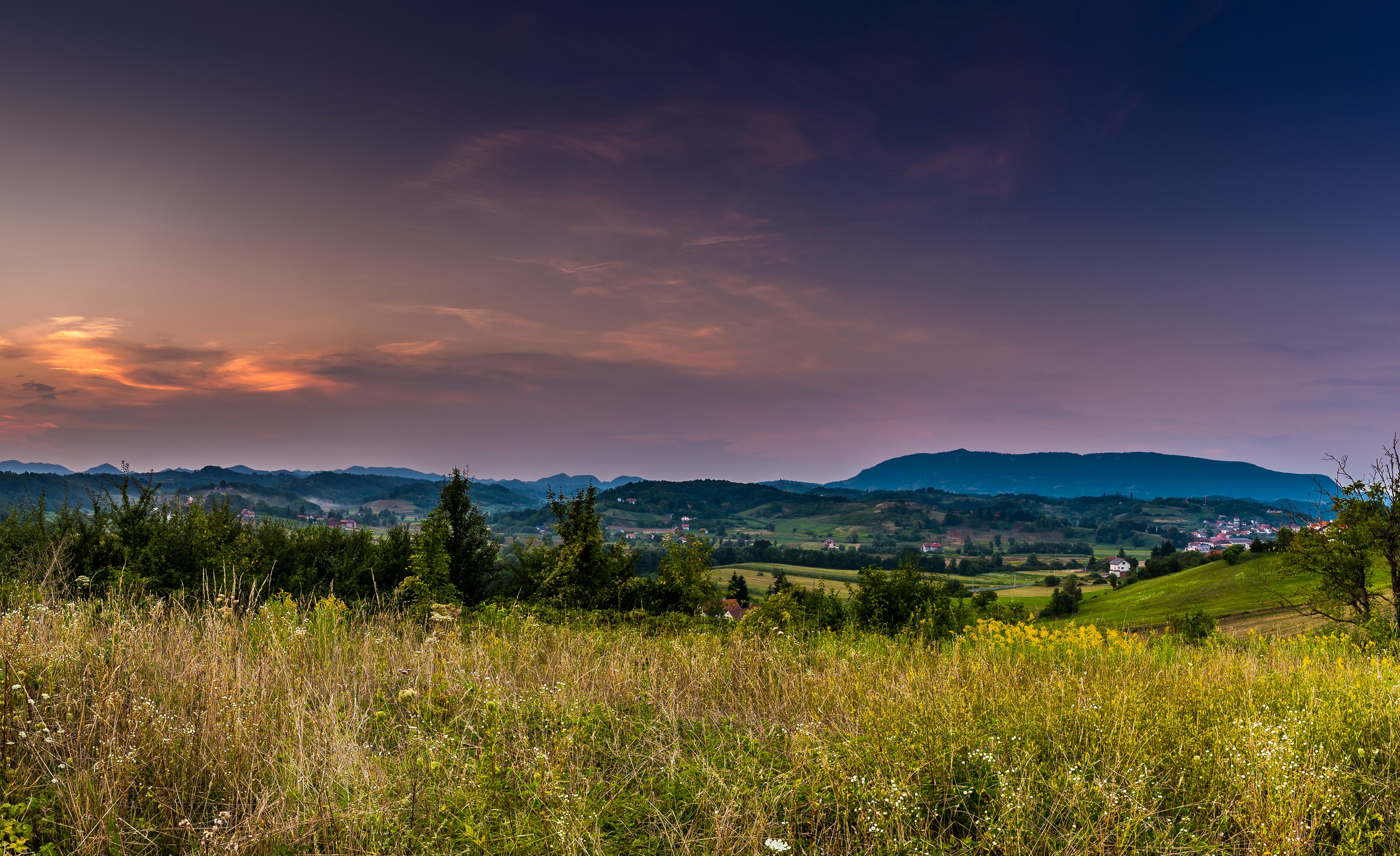 Sunset over rolling hills and fields HD Wallpaper