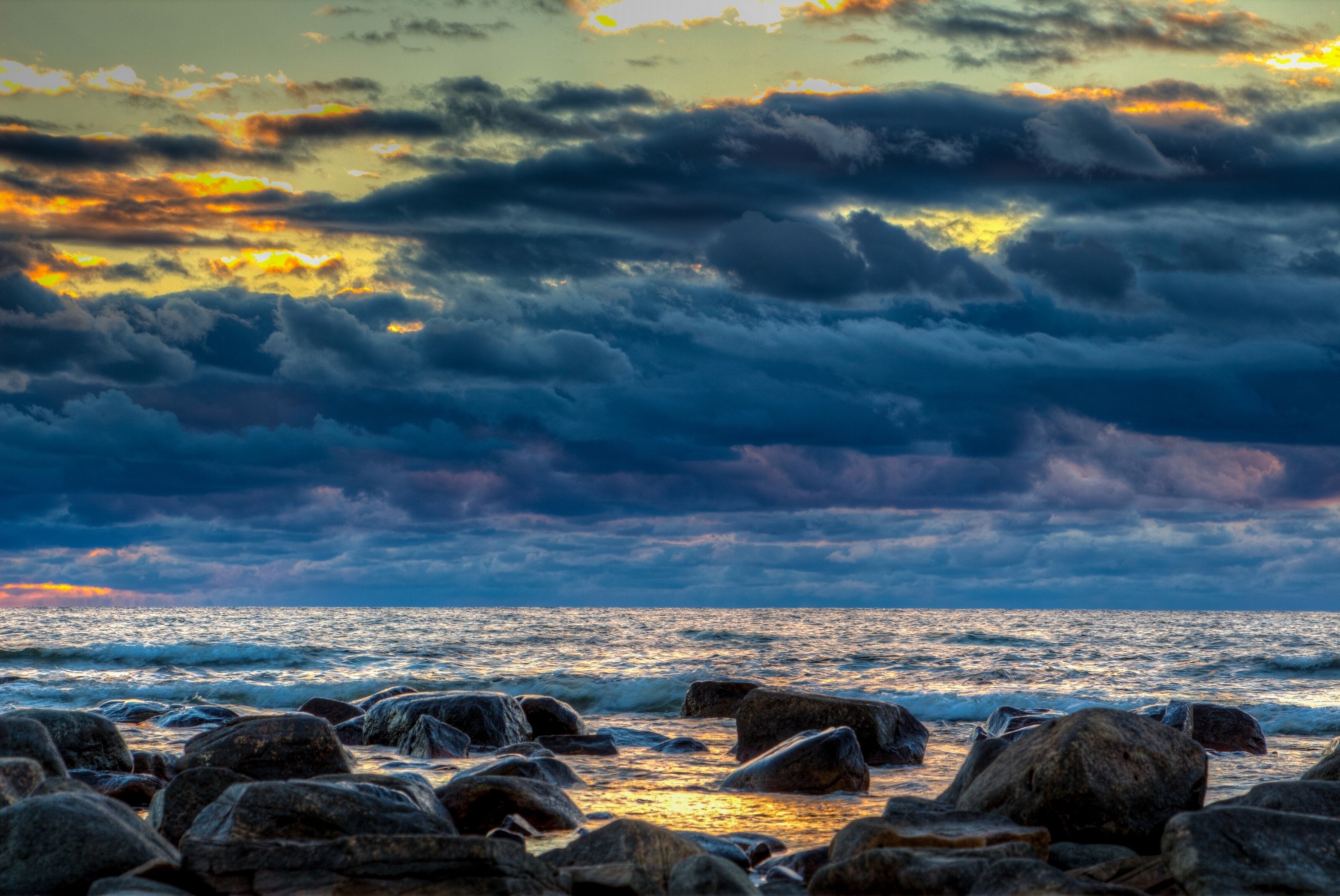 Sunset over the Baltic Sea with rocky shore HD Wallpaper