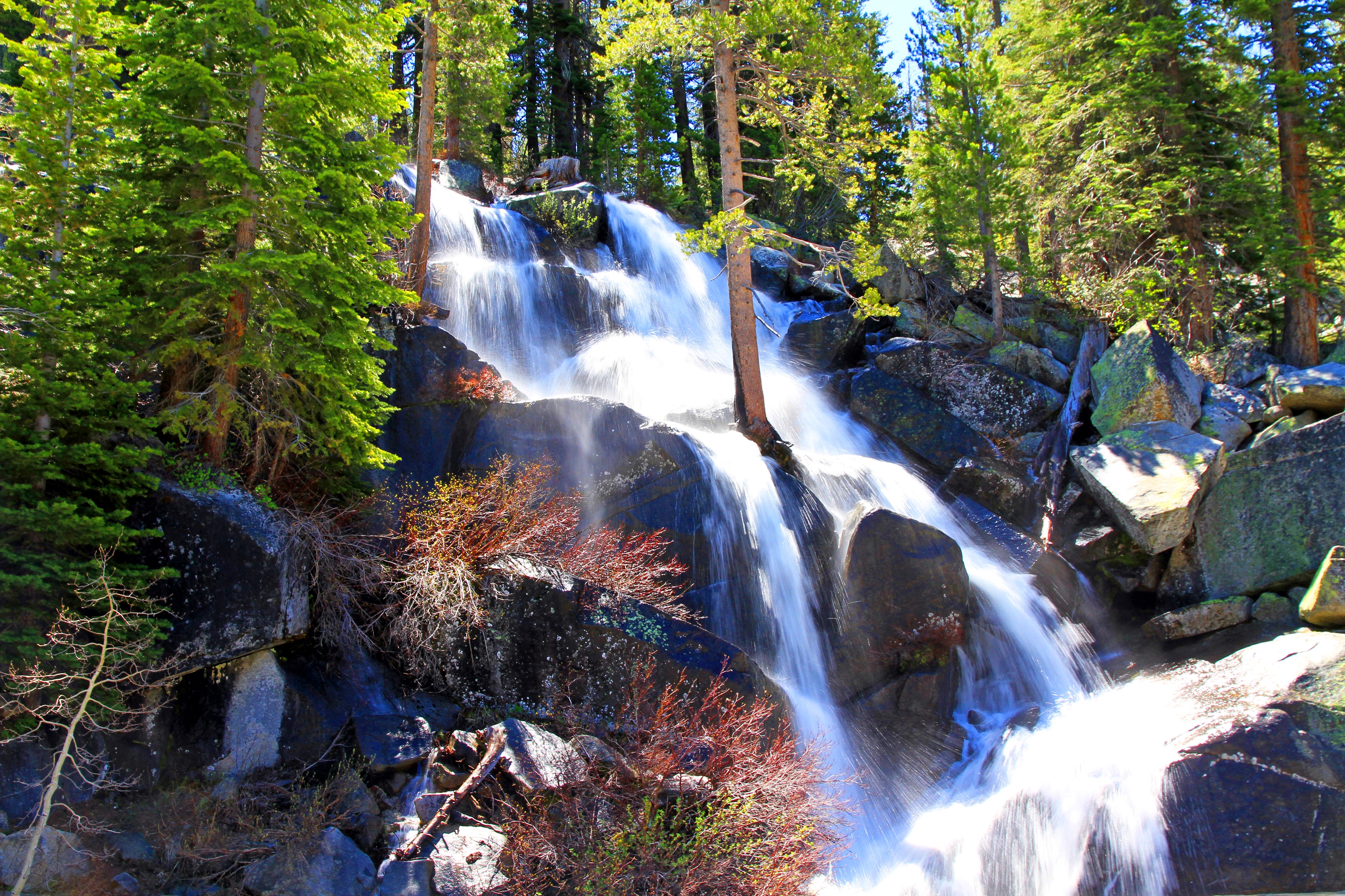 Waterfall cascading over rocks in Yosemite National Park, USA HD Wallpaper