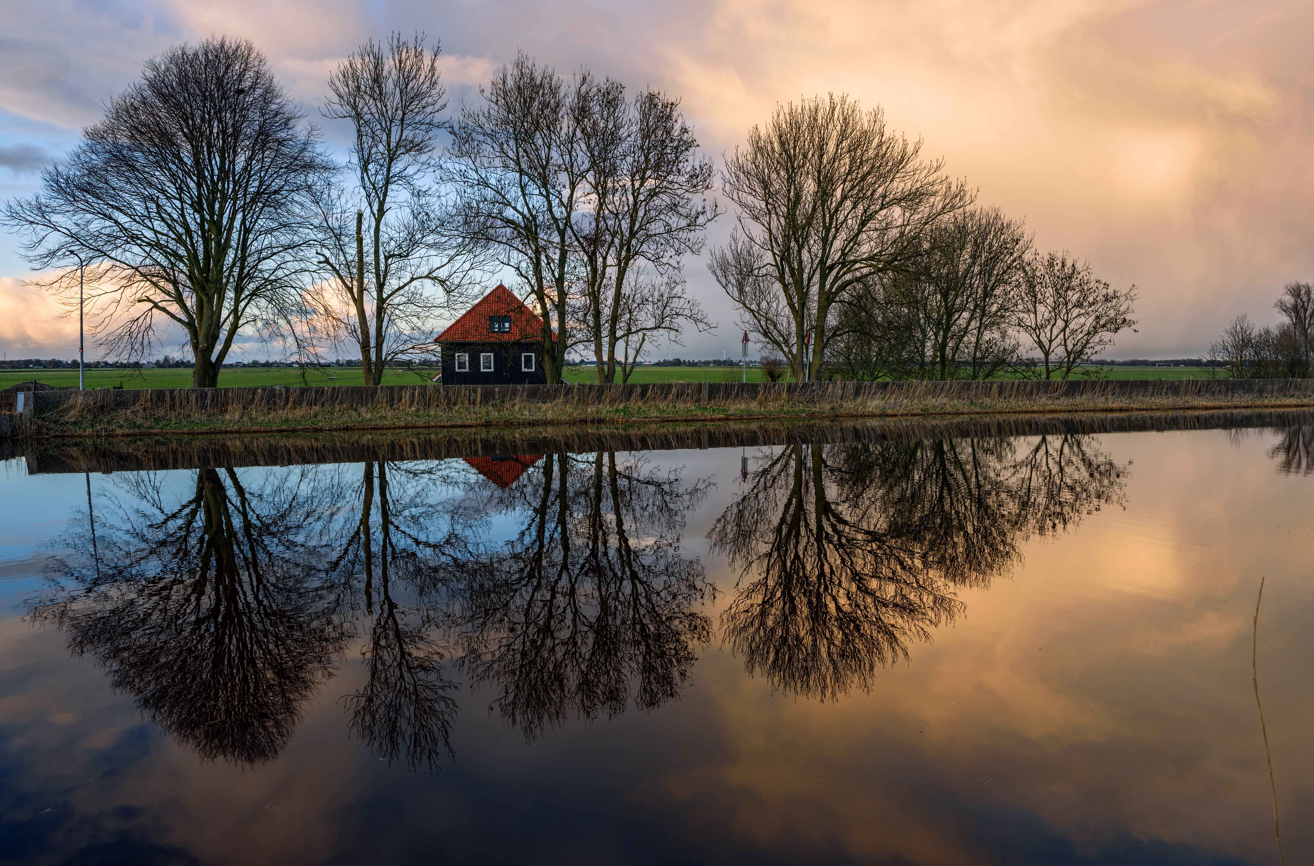 House and trees reflected in water at Oudendijk, Netherlands HD Wallpaper