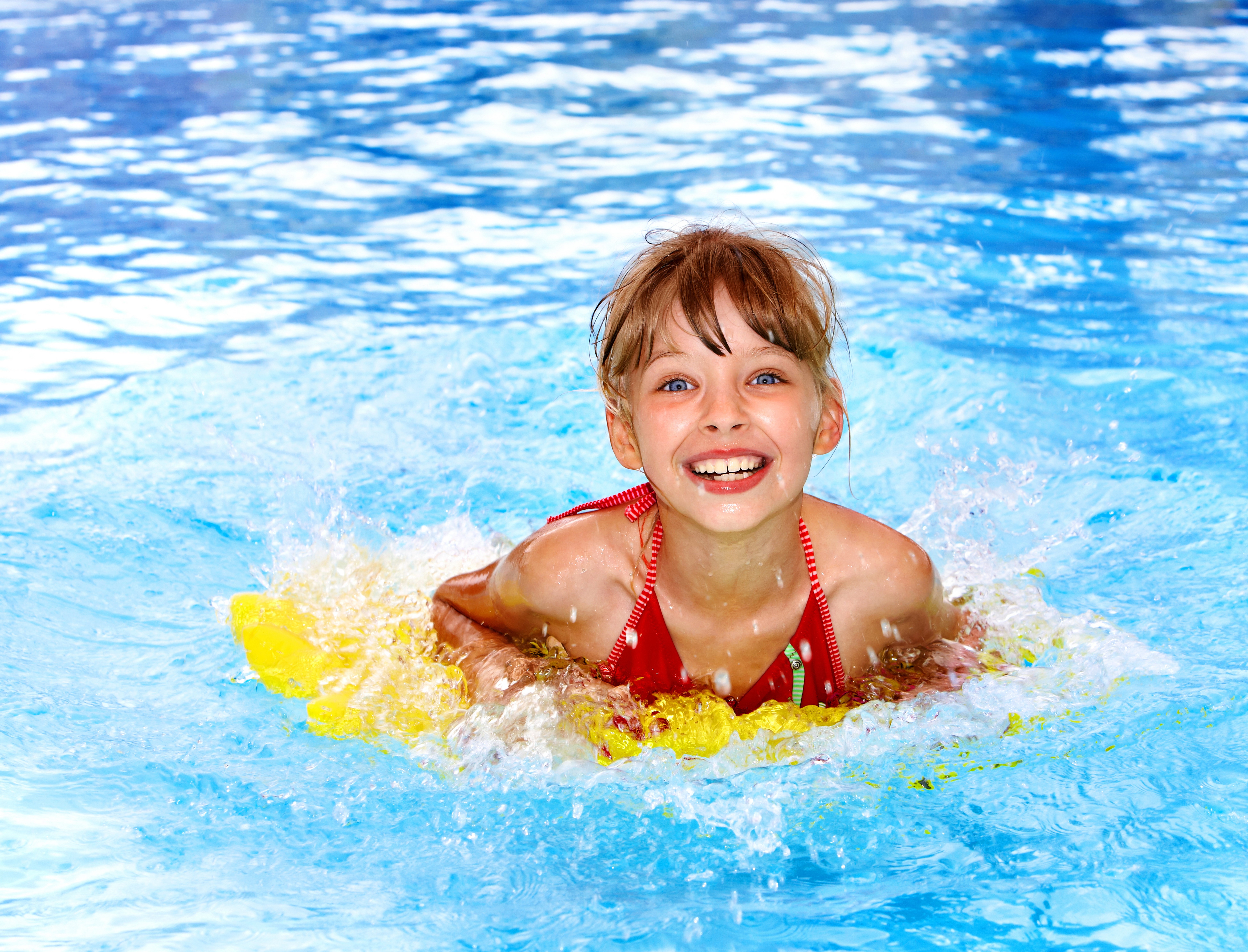 Smiling Little Girl Swimming in Pool 4K HD Wallpaper