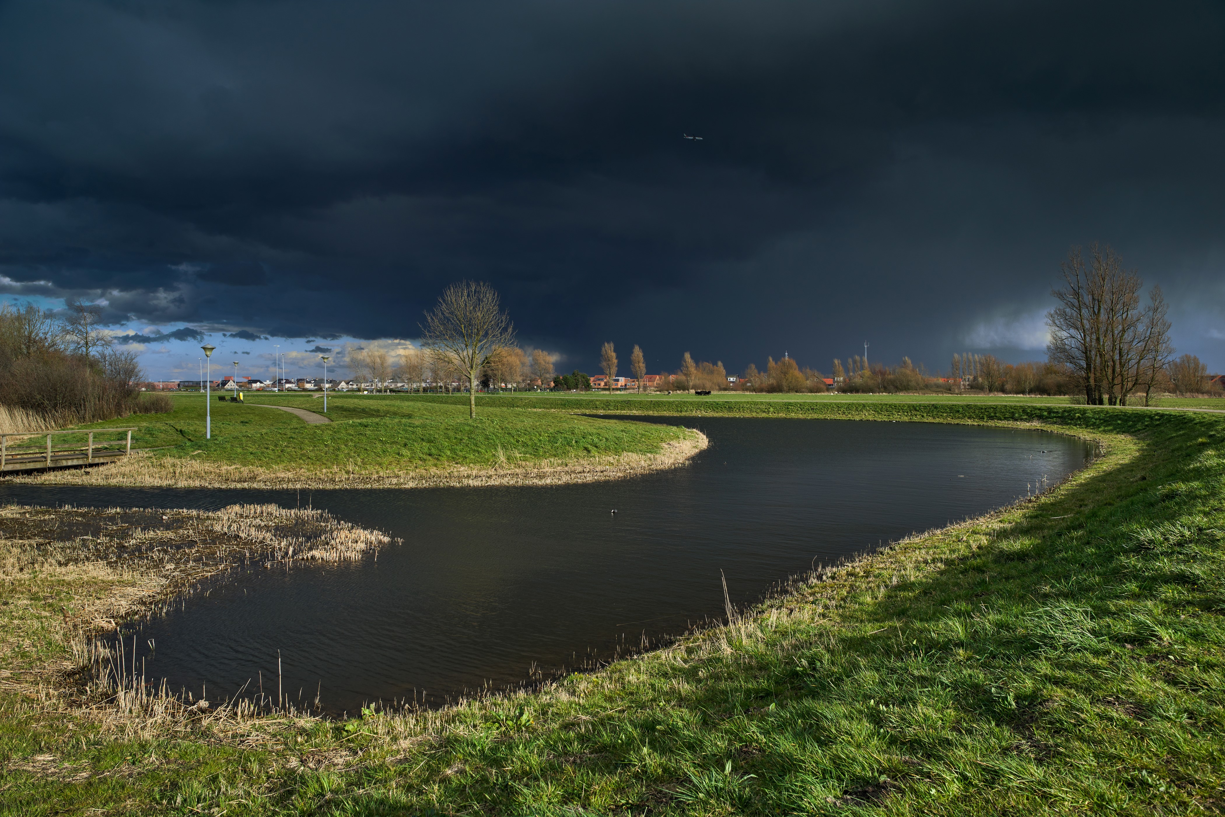 Dark Thunderclouds over a Dutch Landscape with a Pond HD Wallpaper