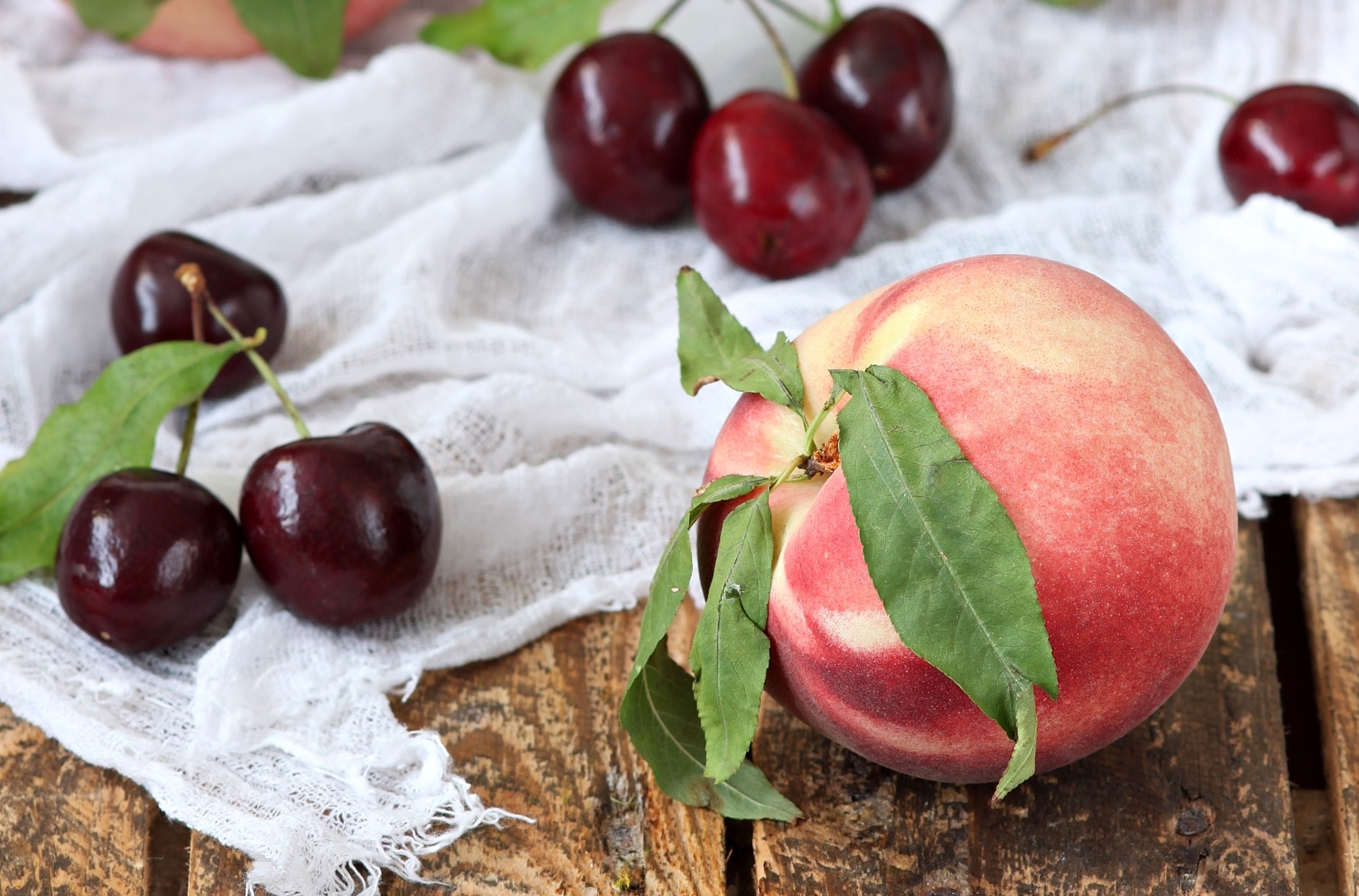 Peaches and Cherries on a Wooden Table HD Wallpaper
