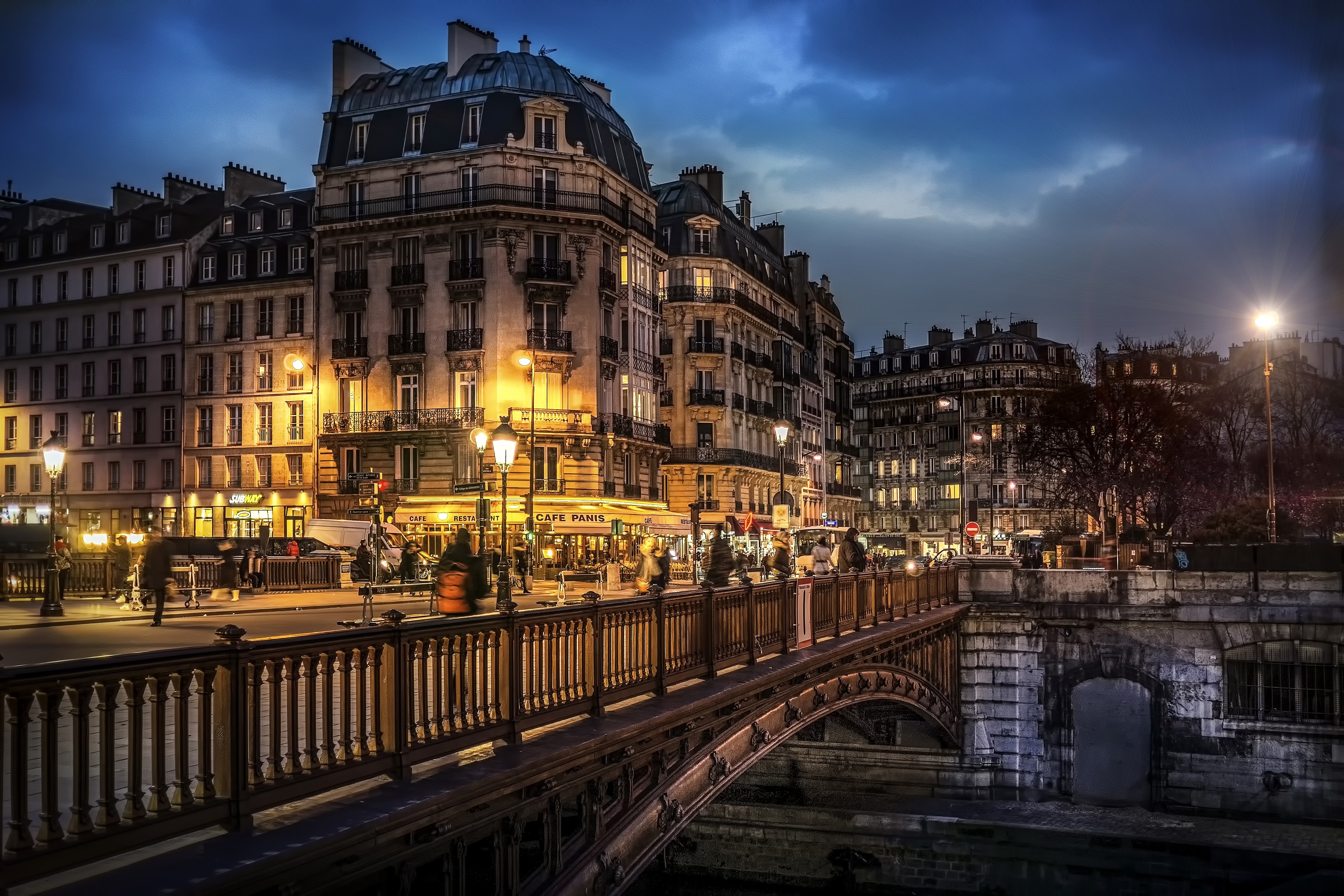 Paris street at night with bridge and buildings HD Wallpaper