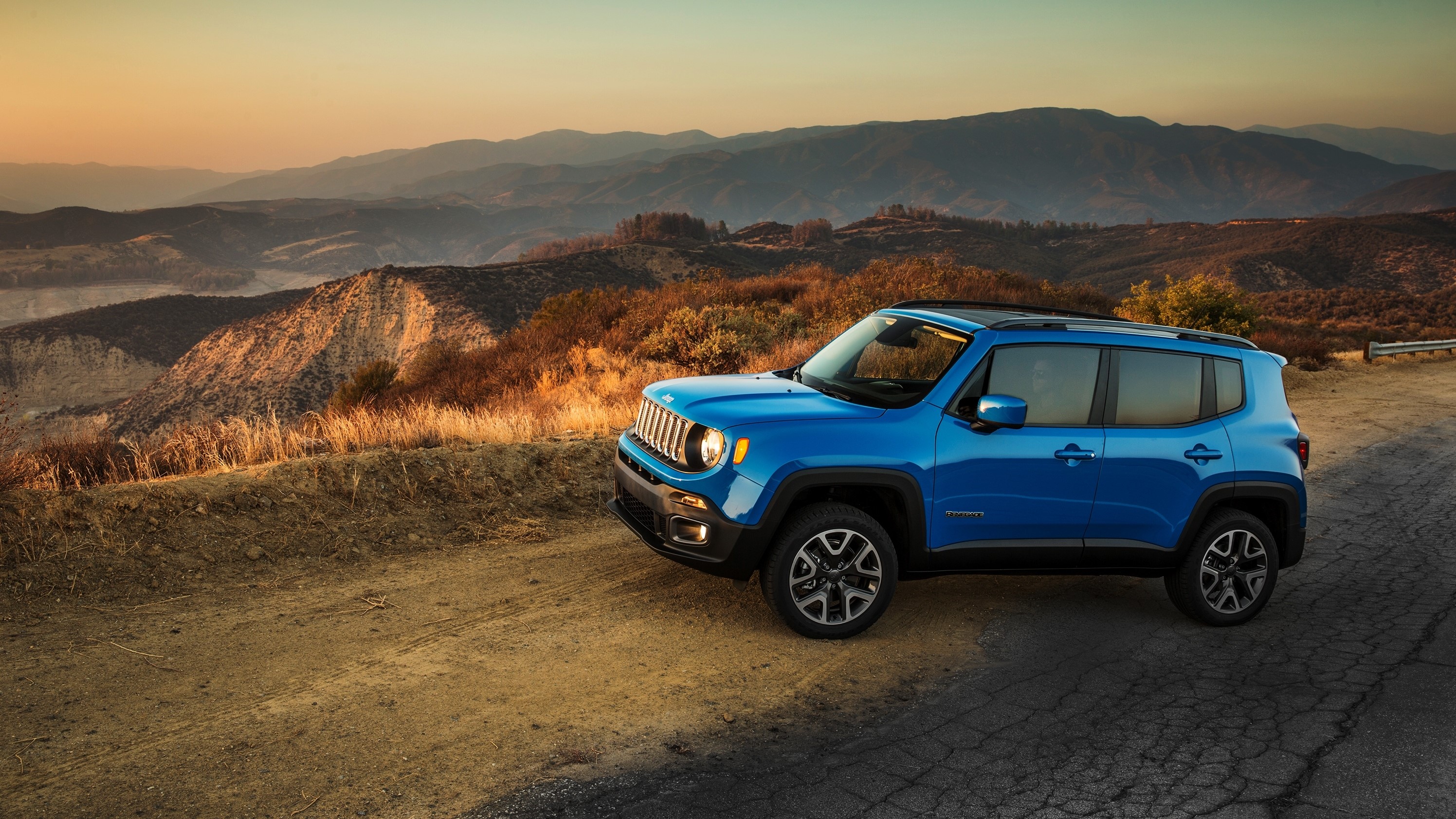 Blue Jeep Renegade Latitude on a mountain road HD Wallpaper