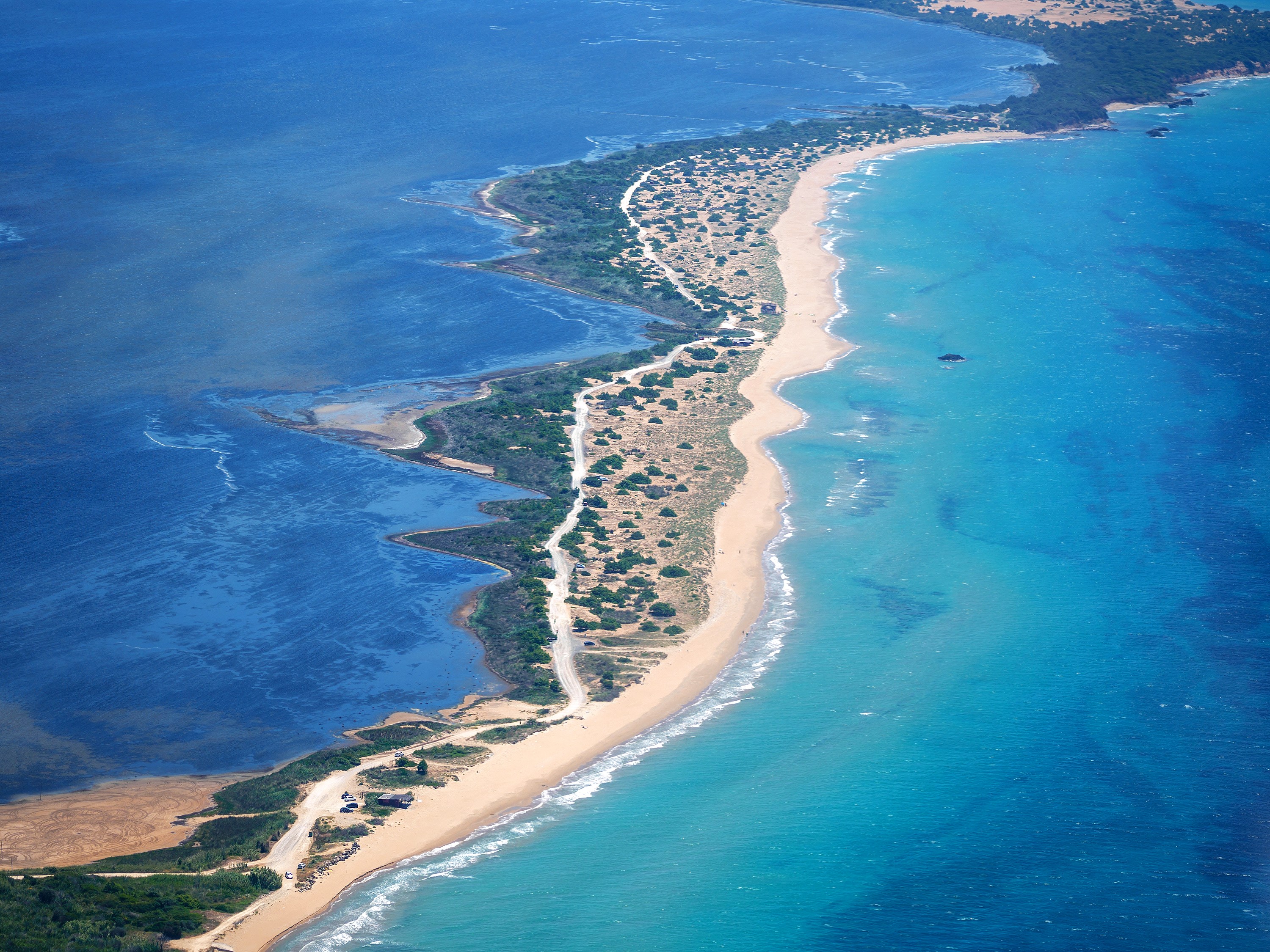Aerial view of a sandy beach and turquoise sea in Greece HD Wallpaper