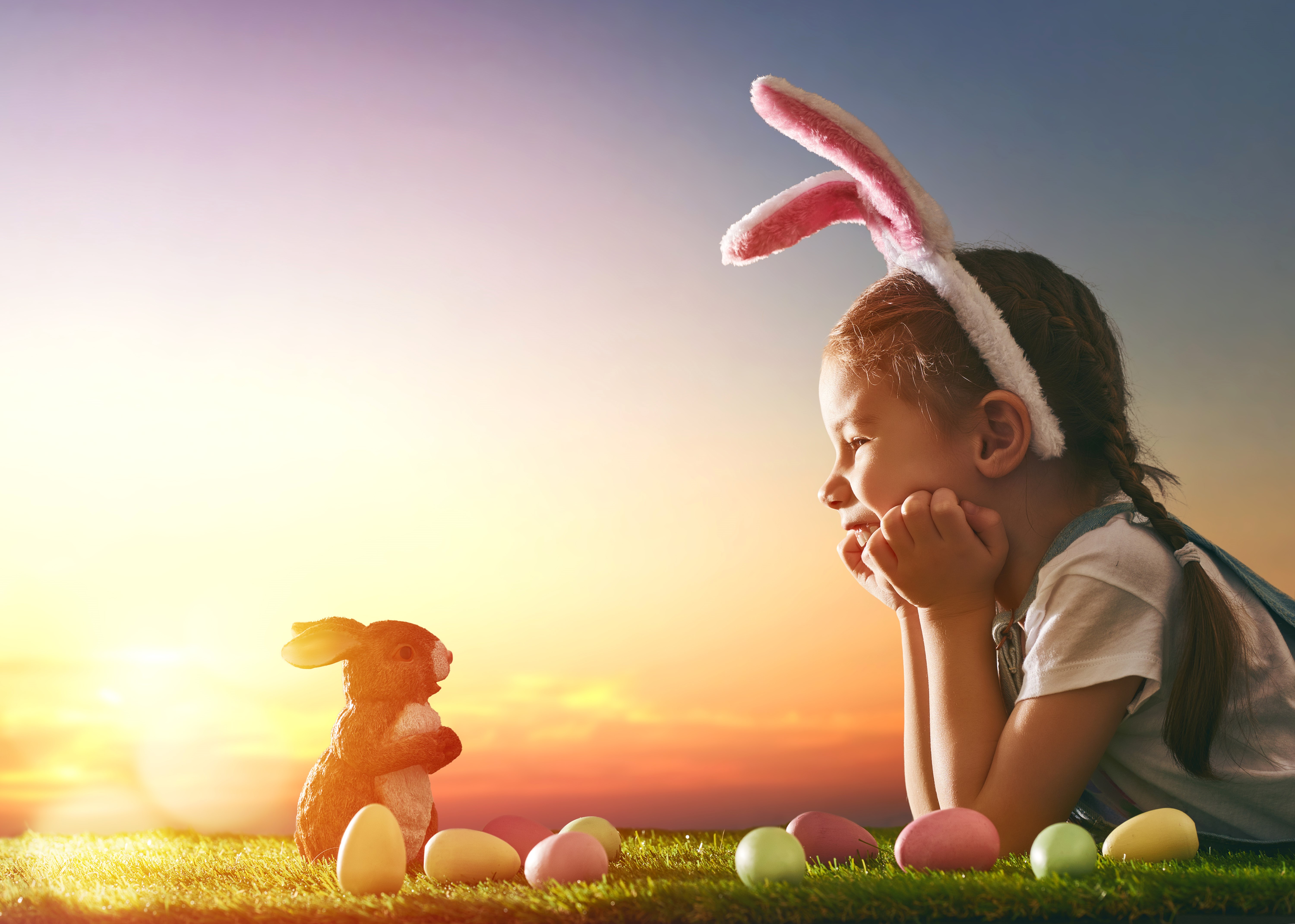 Girl with bunny ears and Easter eggs at sunset HD Wallpaper