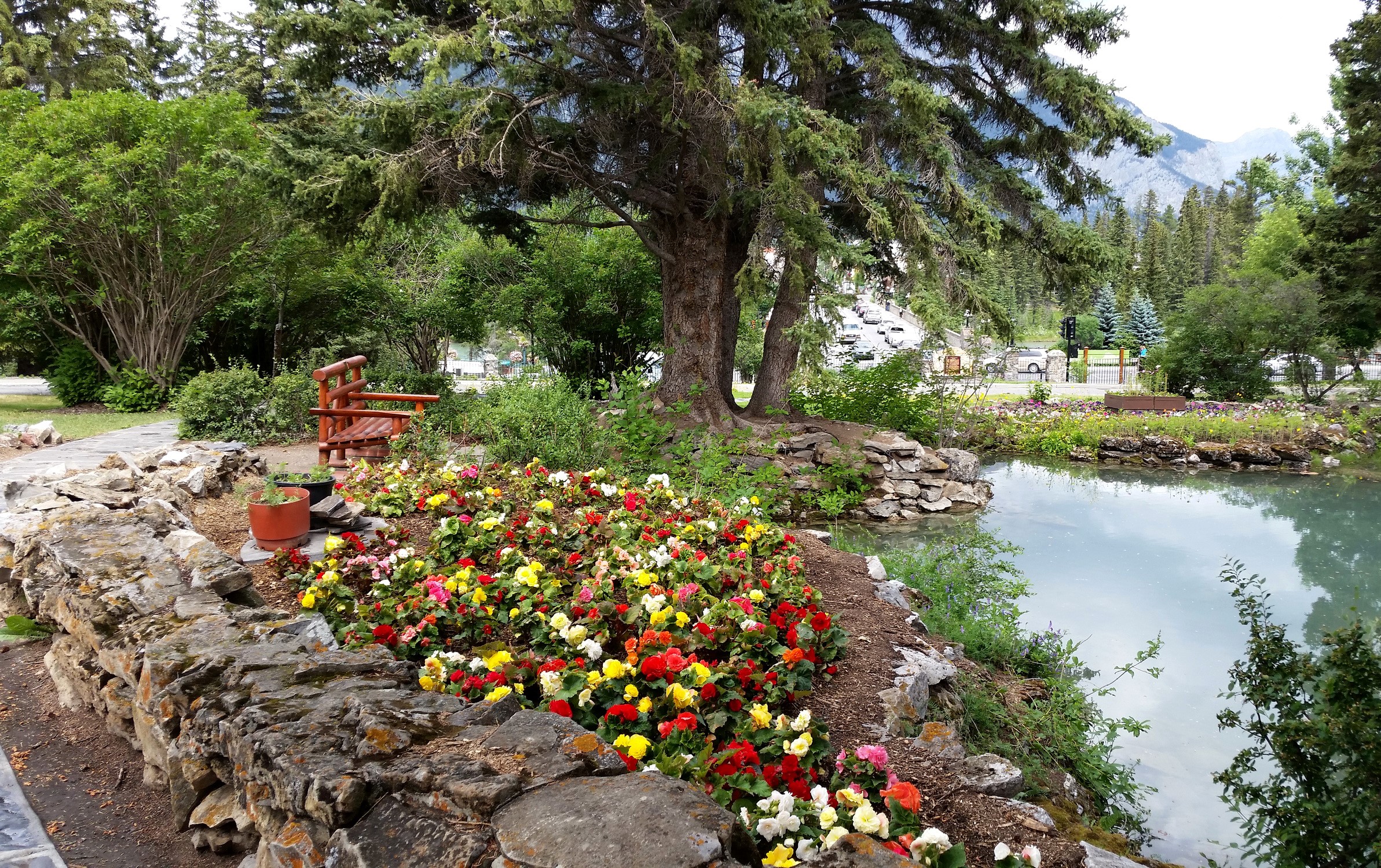 Cascade Gardens Pond with Flowers and Bench HD Wallpaper