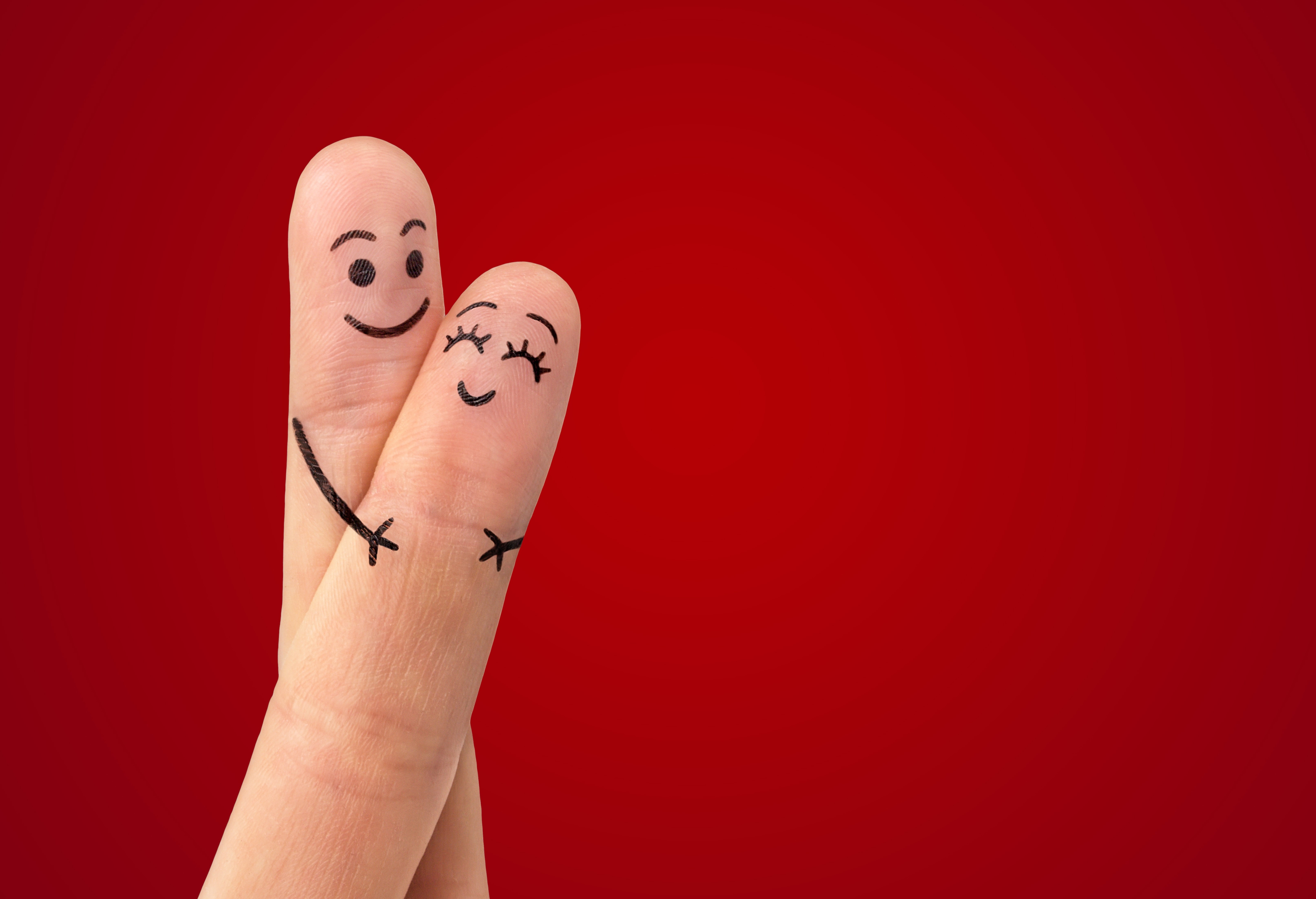 Two fingers with smiley faces hugging HD Wallpaper