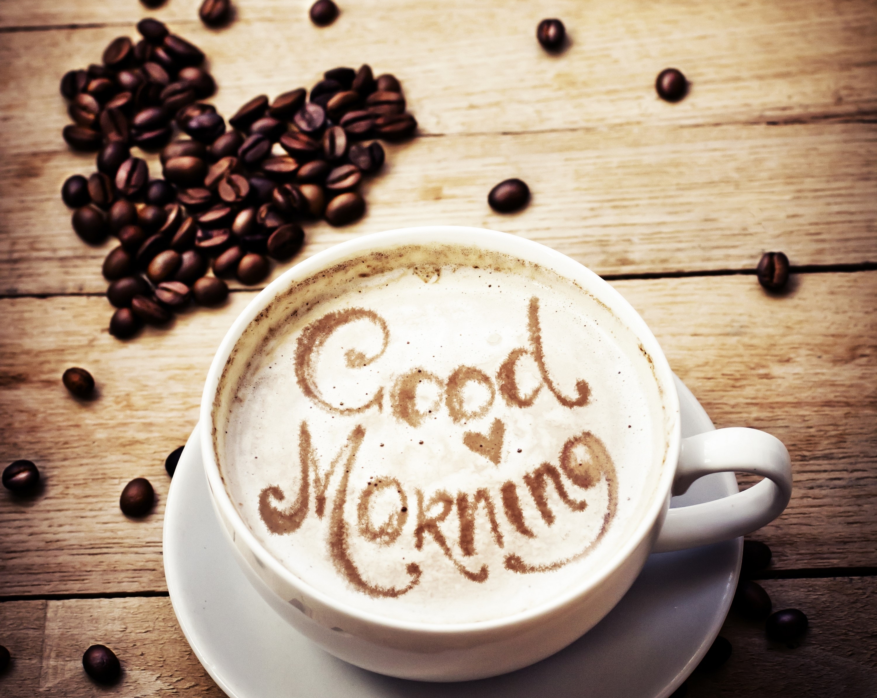 Coffee cup with "Good Morning" written in foam and coffee beans HD Wallpaper