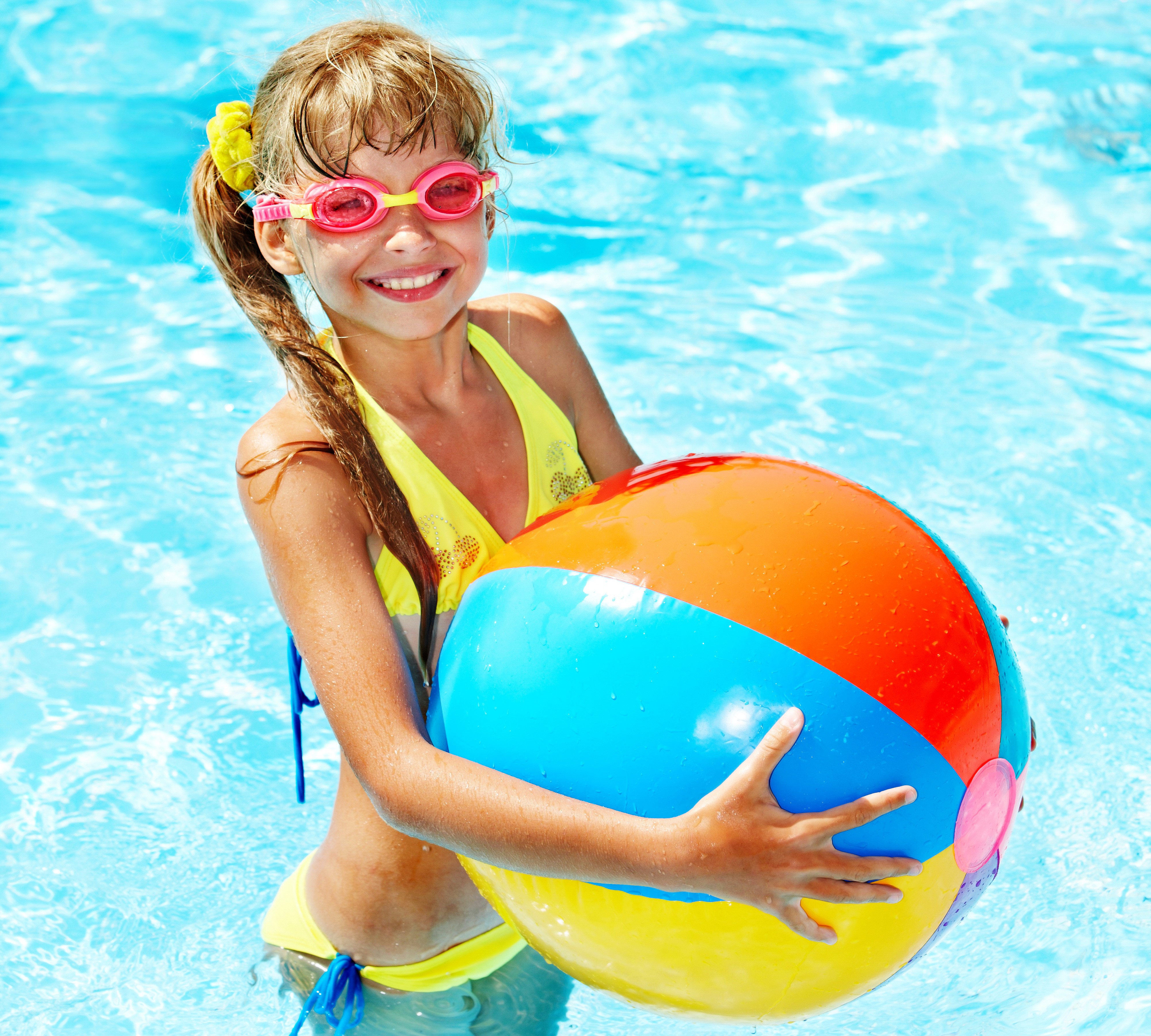 Smiling Girl with Beach Ball in Pool 4K HD Wallpaper