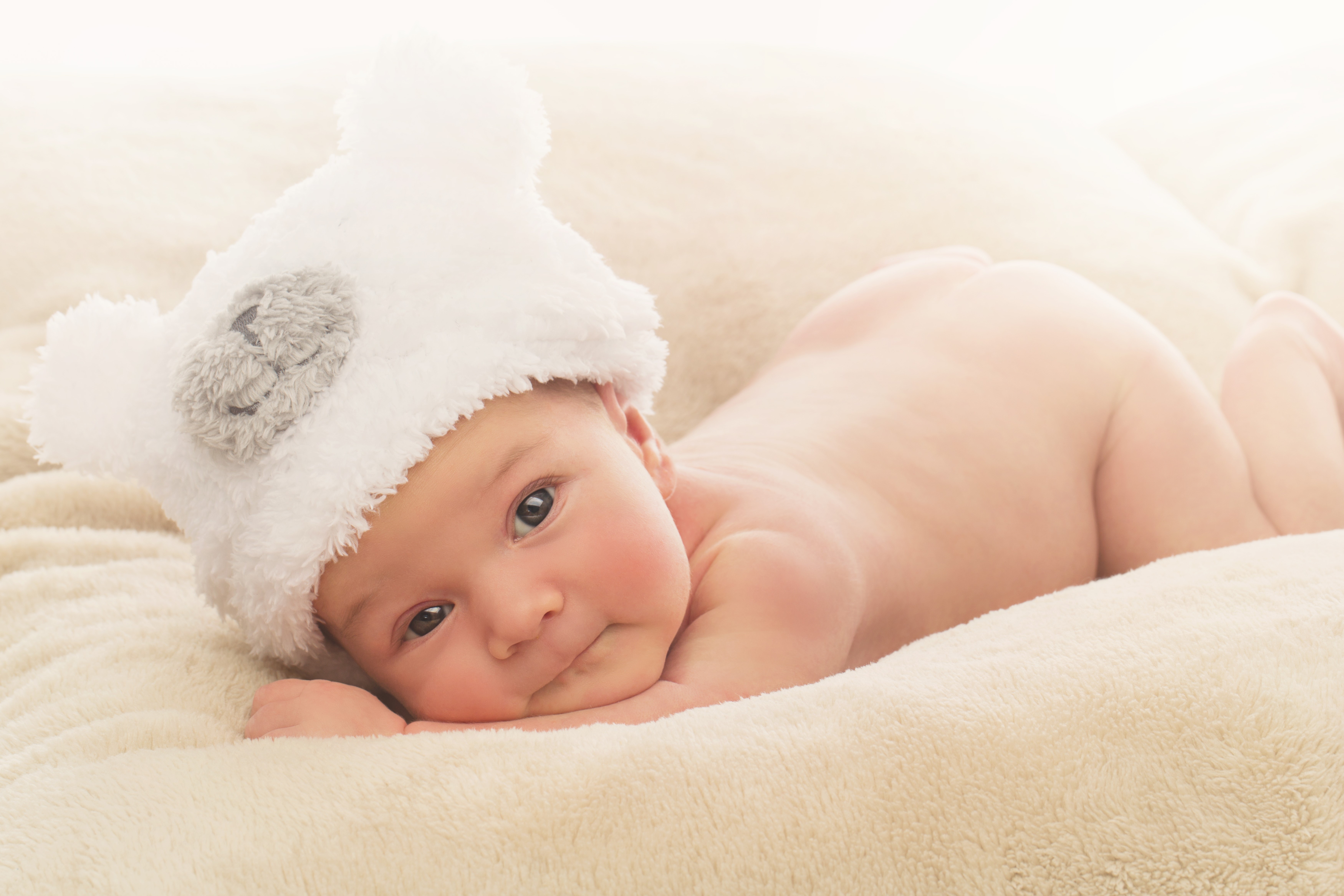 Newborn baby wearing a bear hat HD Wallpaper