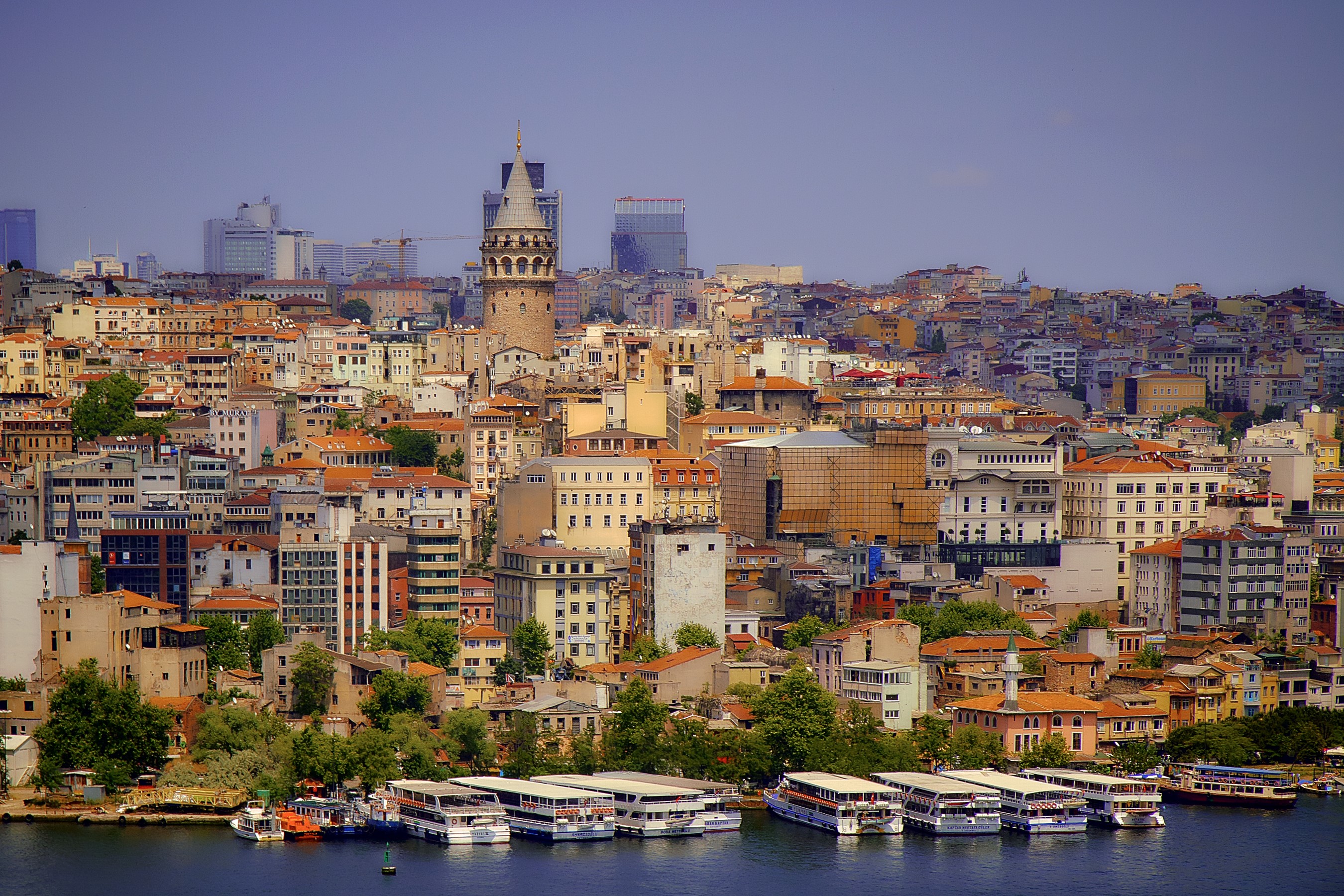 Galata Tower and Istanbul skyline with boats HD Wallpaper
