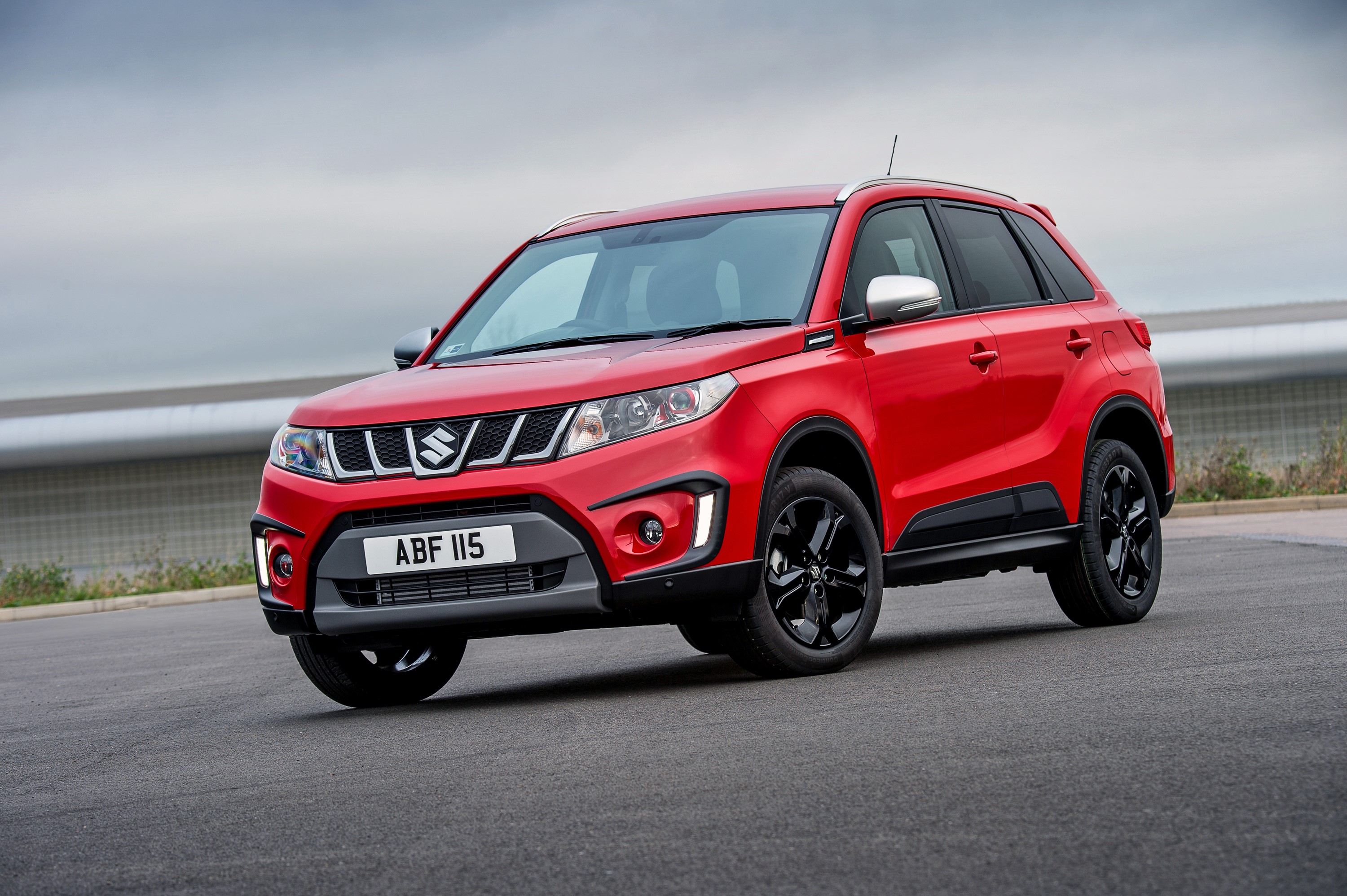 Red Suzuki Vitara parked on asphalt HD Wallpaper