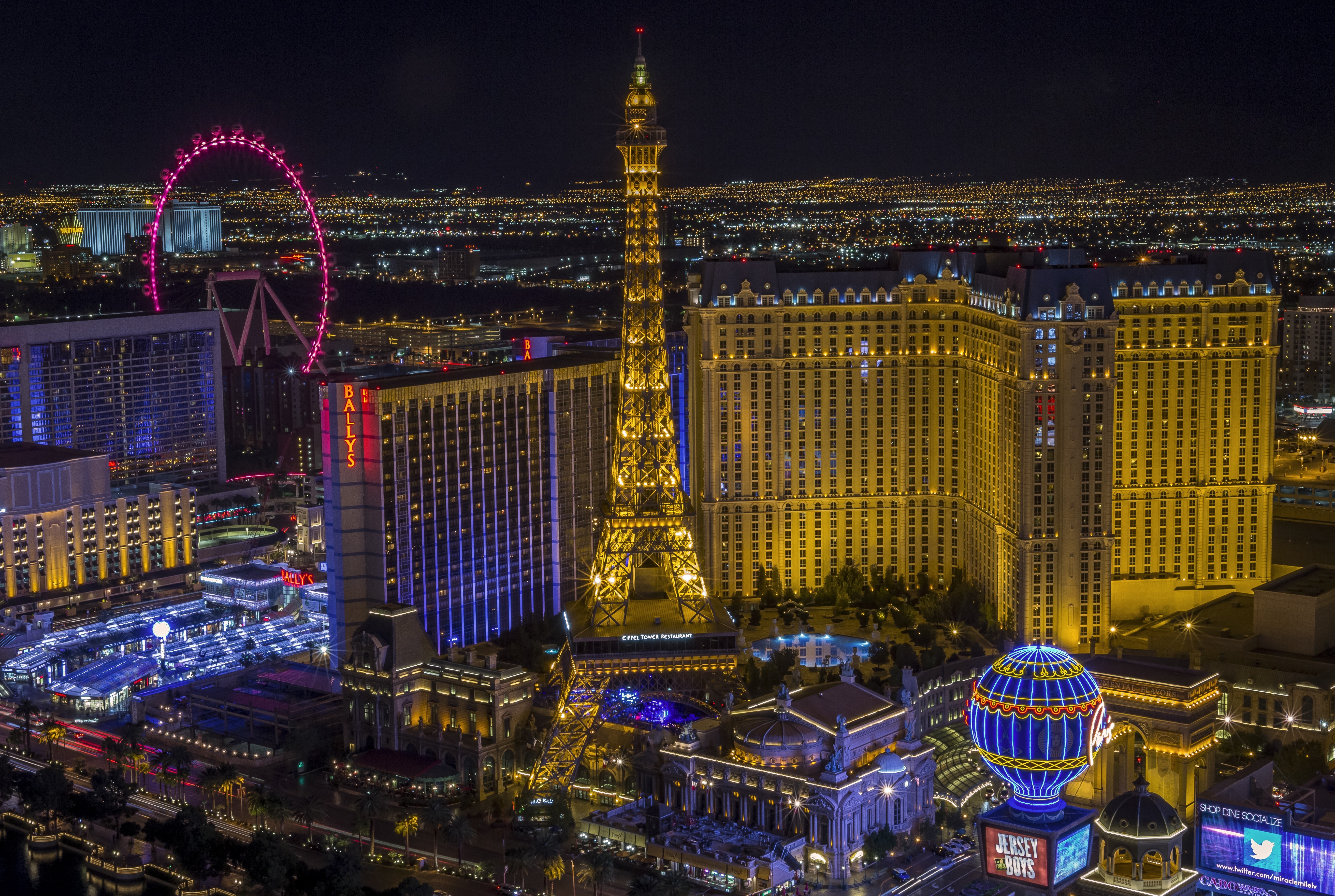 Las Vegas Strip at Night with Eiffel Tower and High Roller HD Wallpaper